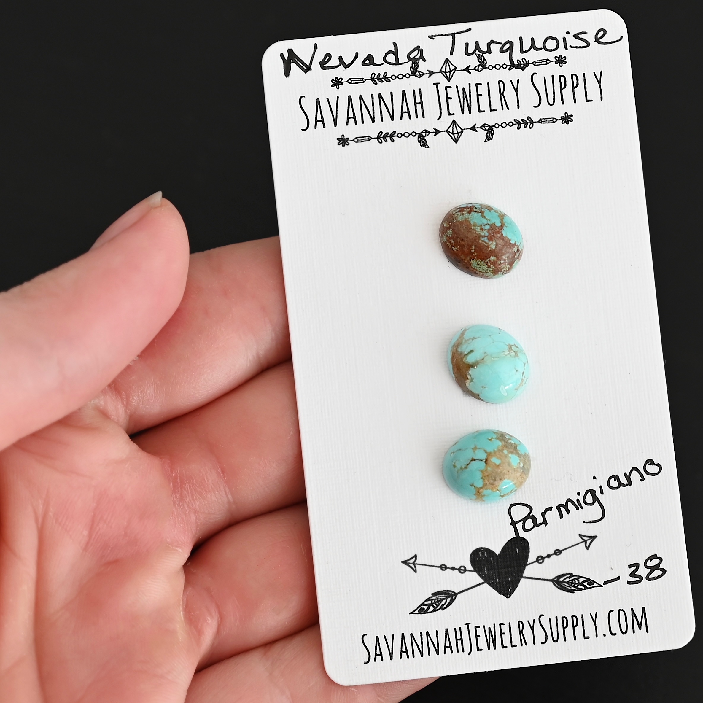 Parmigiana Turquoise Cabochon Parcel shown in hand