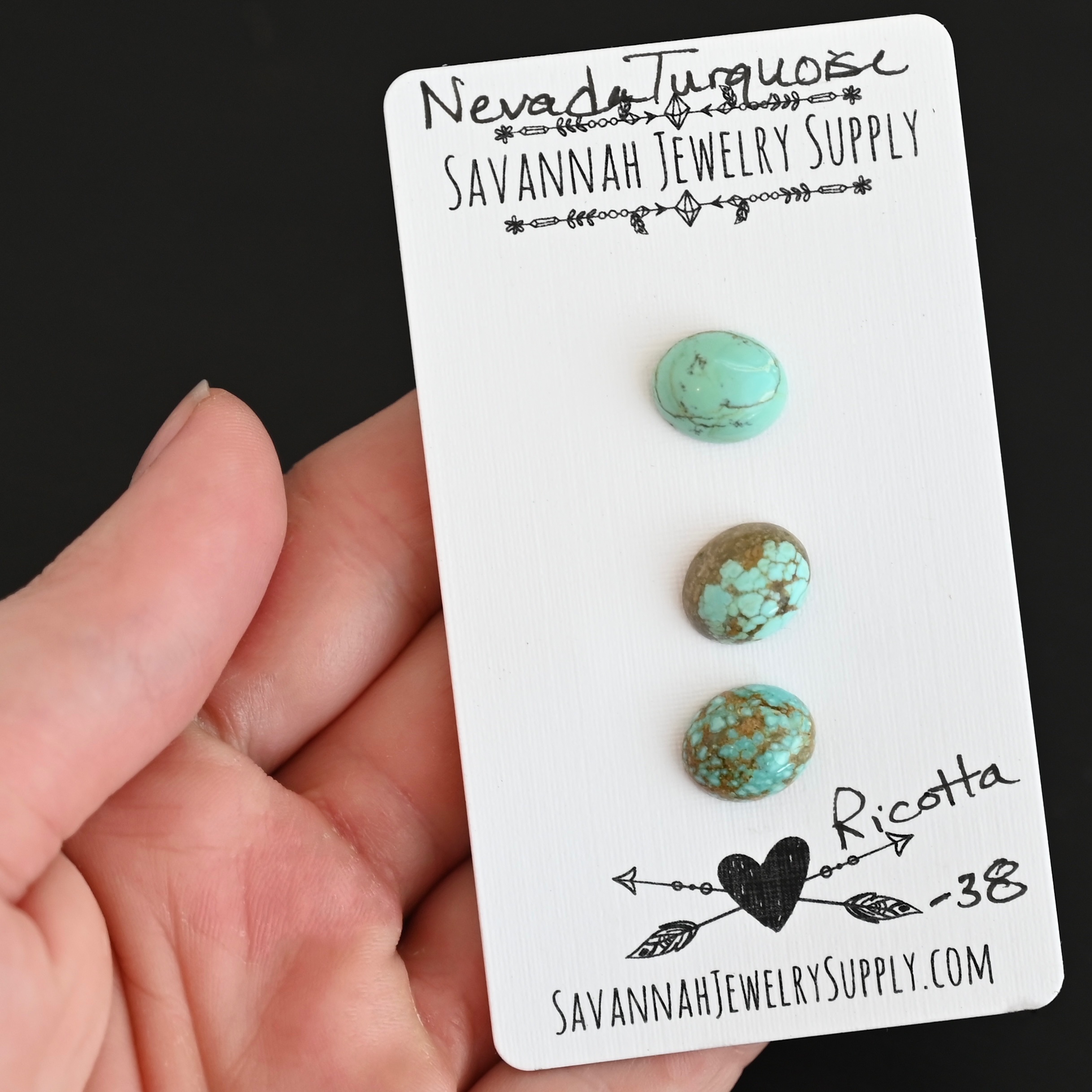 Ricotta Turquoise Cabochon Parcel shown in hand