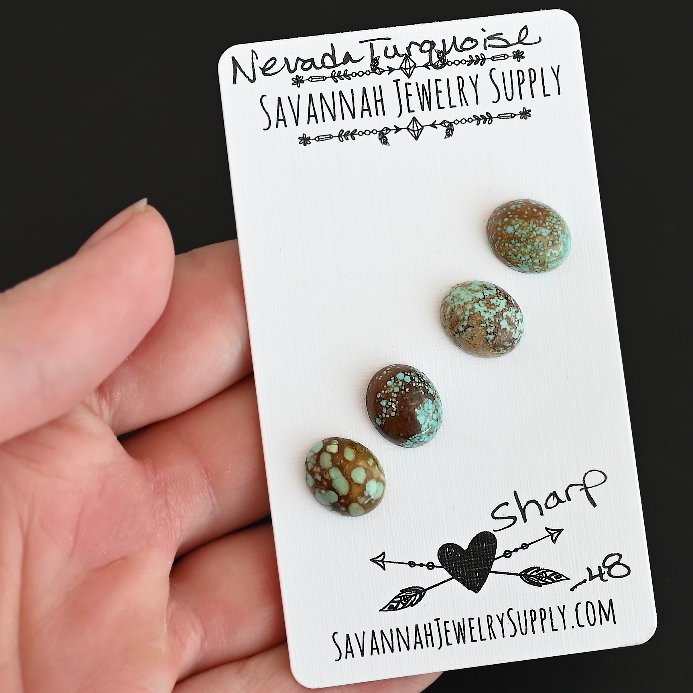 Sharp Turquoise Cabochon Parcel shown in hand