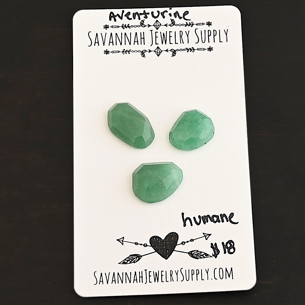 Humane Rose Cut Aventurine Cabochon Parcel shown on business card