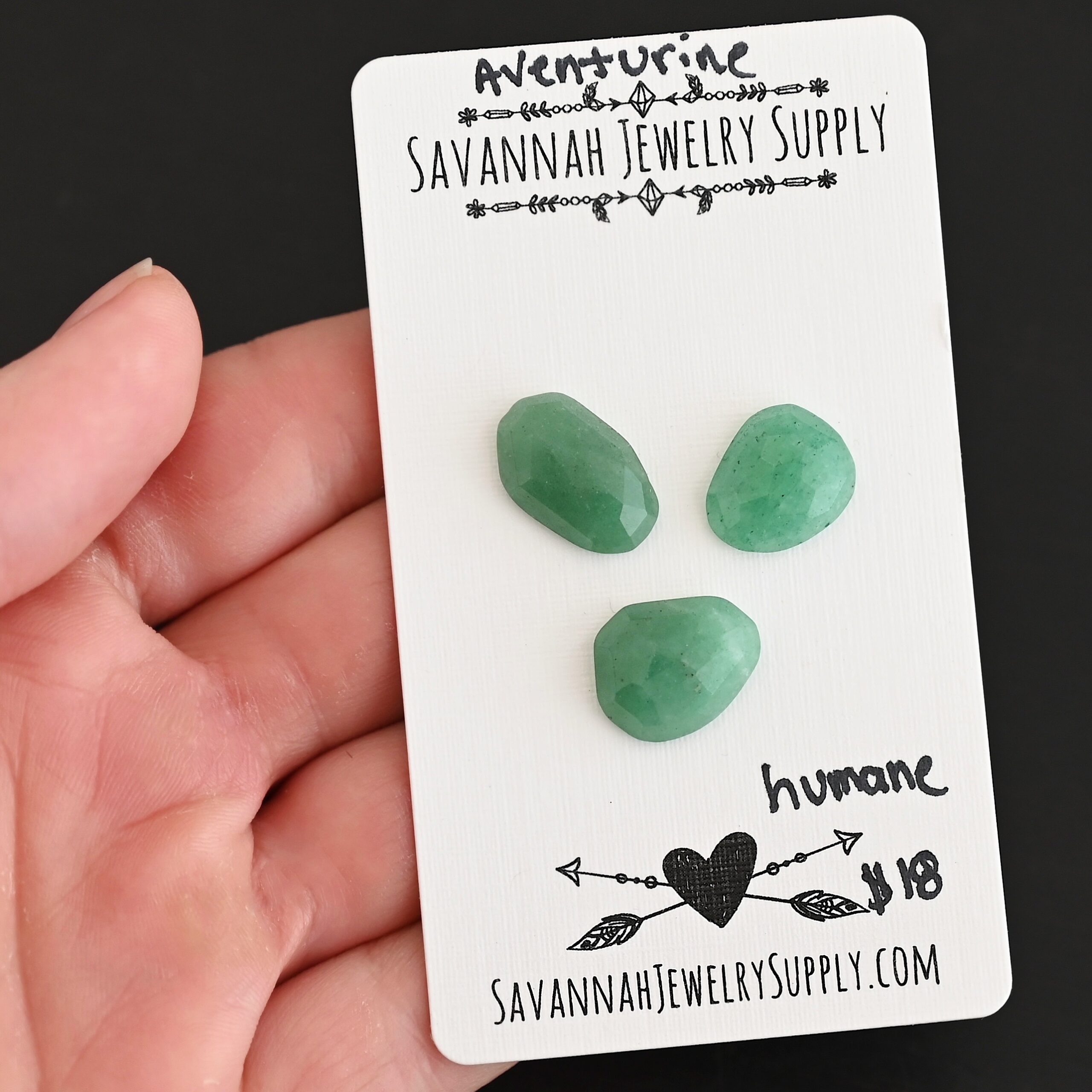 Humane Rose Cut Aventurine Cabochon Parcel shown in hand