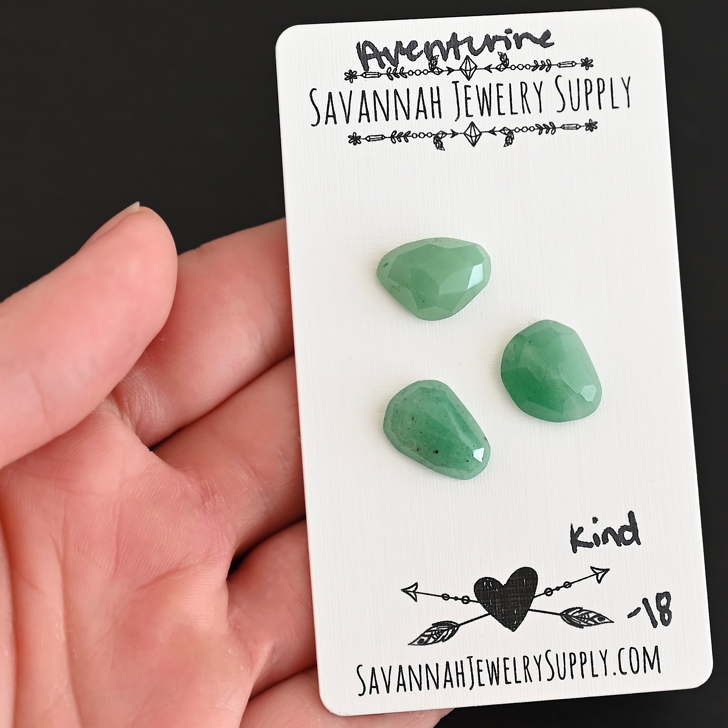 Kind Rose Cut Aventurine Cabochon Parcel shown in hand