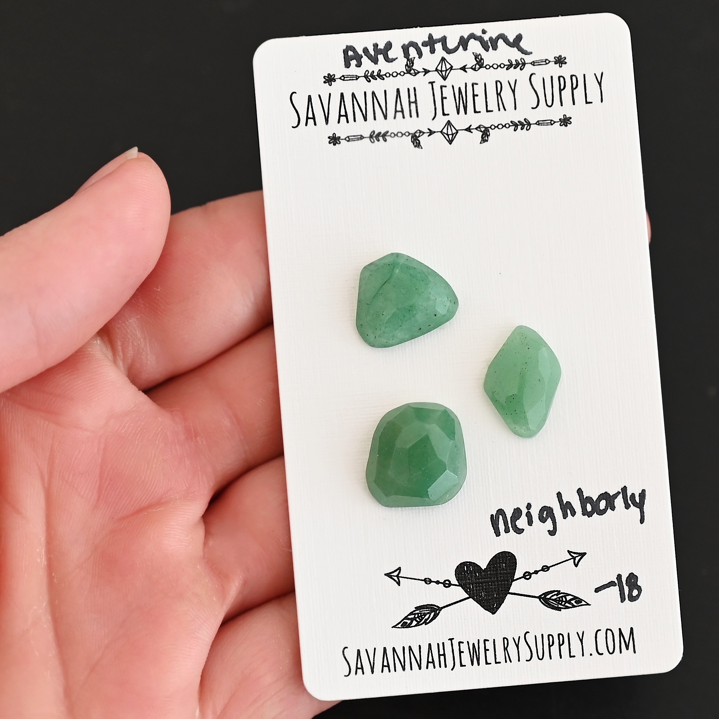 Neighborly Rose Cut Aventurine Cabochon Parcel shown in hand