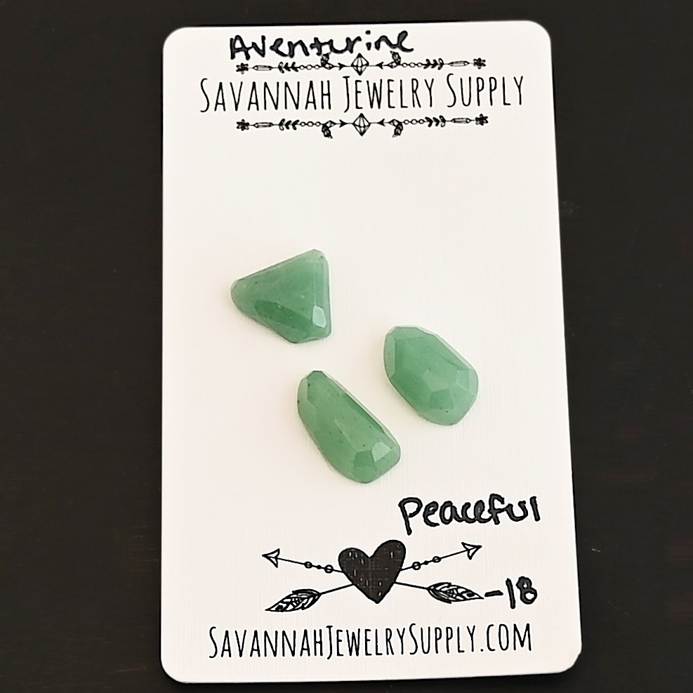 Peaceful Rose Cut Aventurine Cabochon Parcel shown on business card