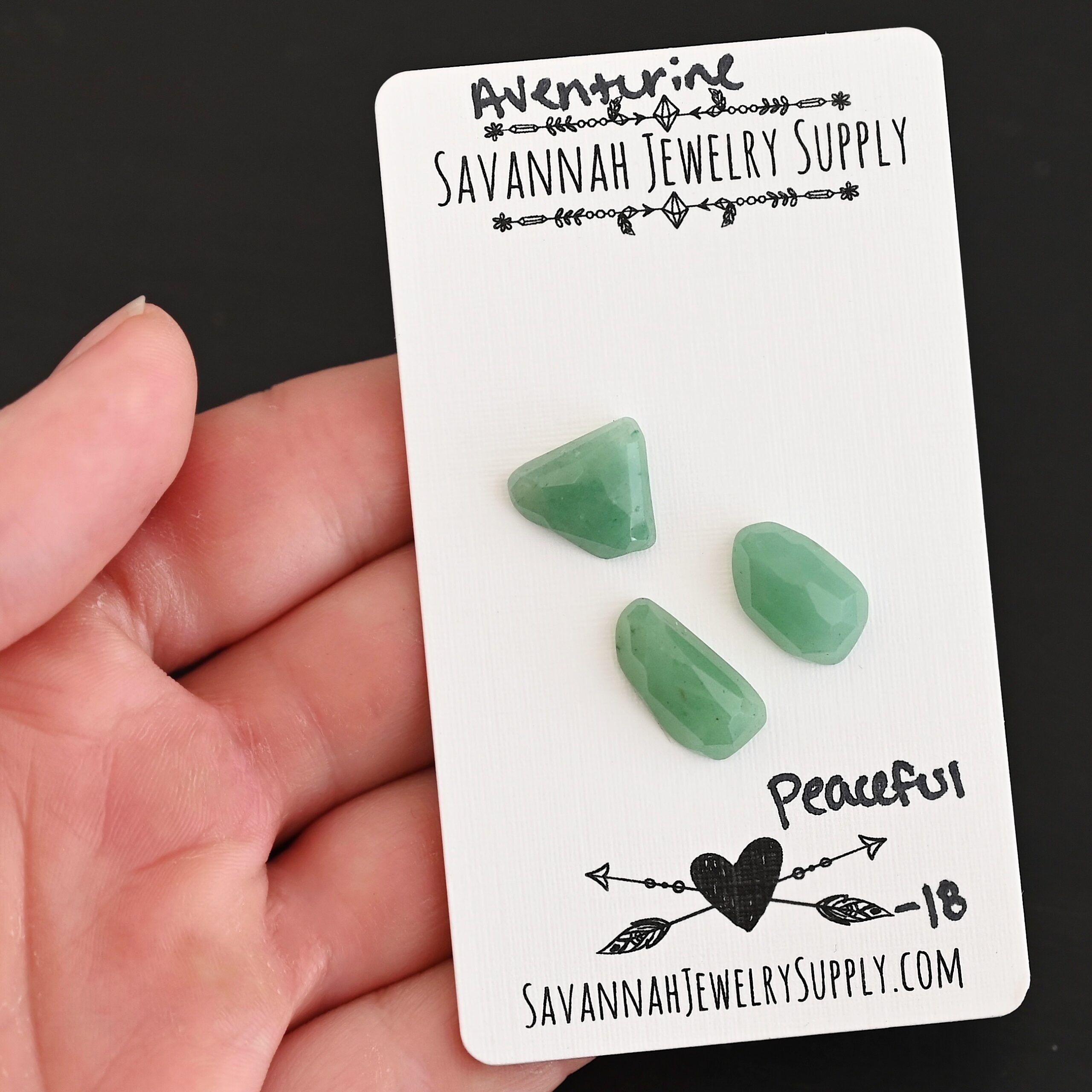 Peaceful Rose Cut Aventurine Cabochon Parcel shown in hand