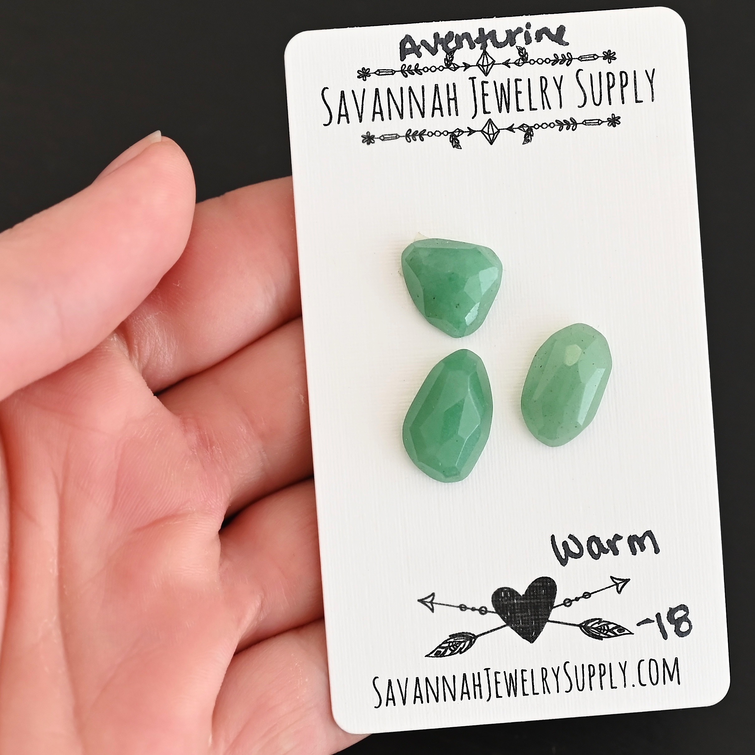 Warm Rose Cut Aventurine Cabochon Parcel shown in hand