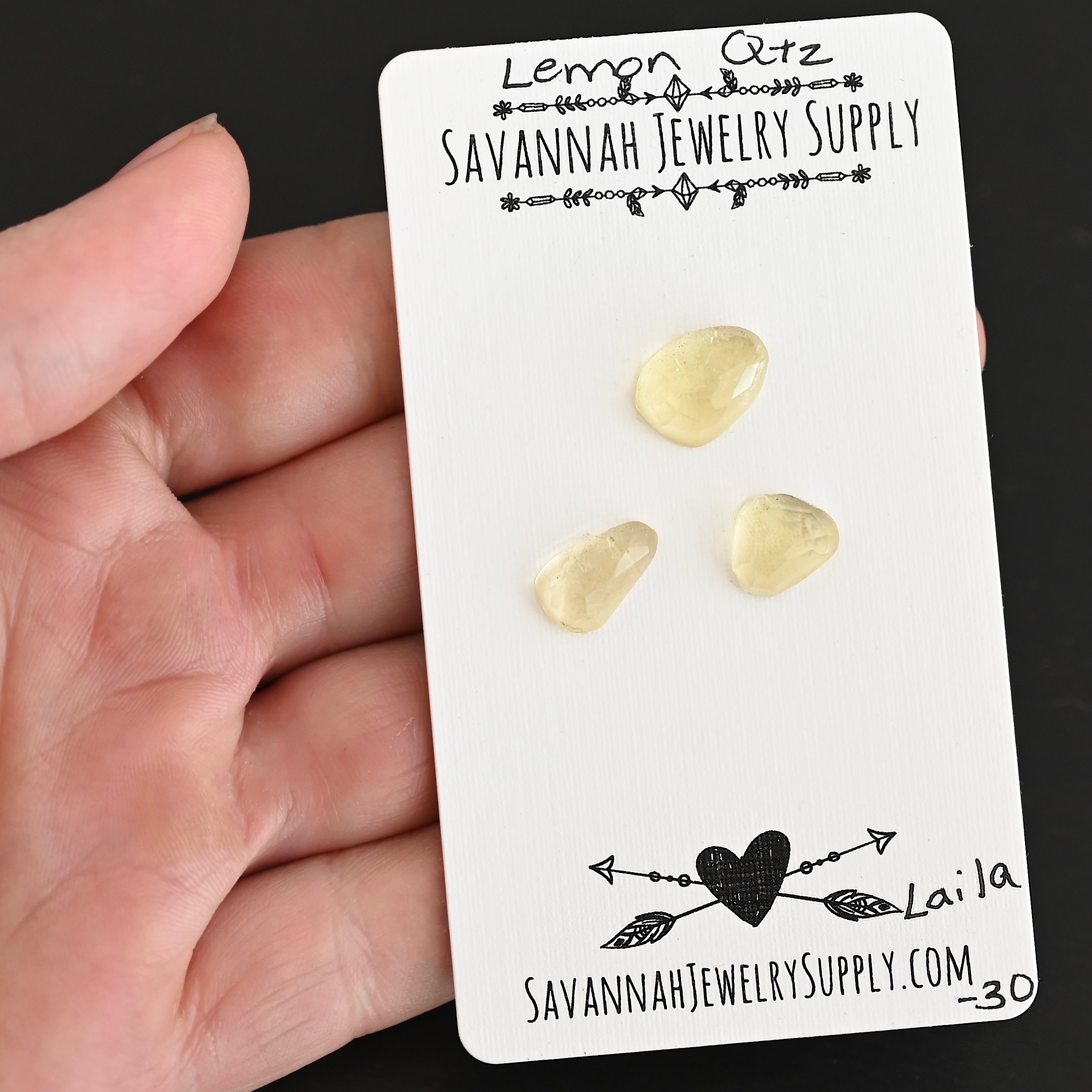 Laila Rose Cut Lemon Quartz Cabochon Parcel shown in hand