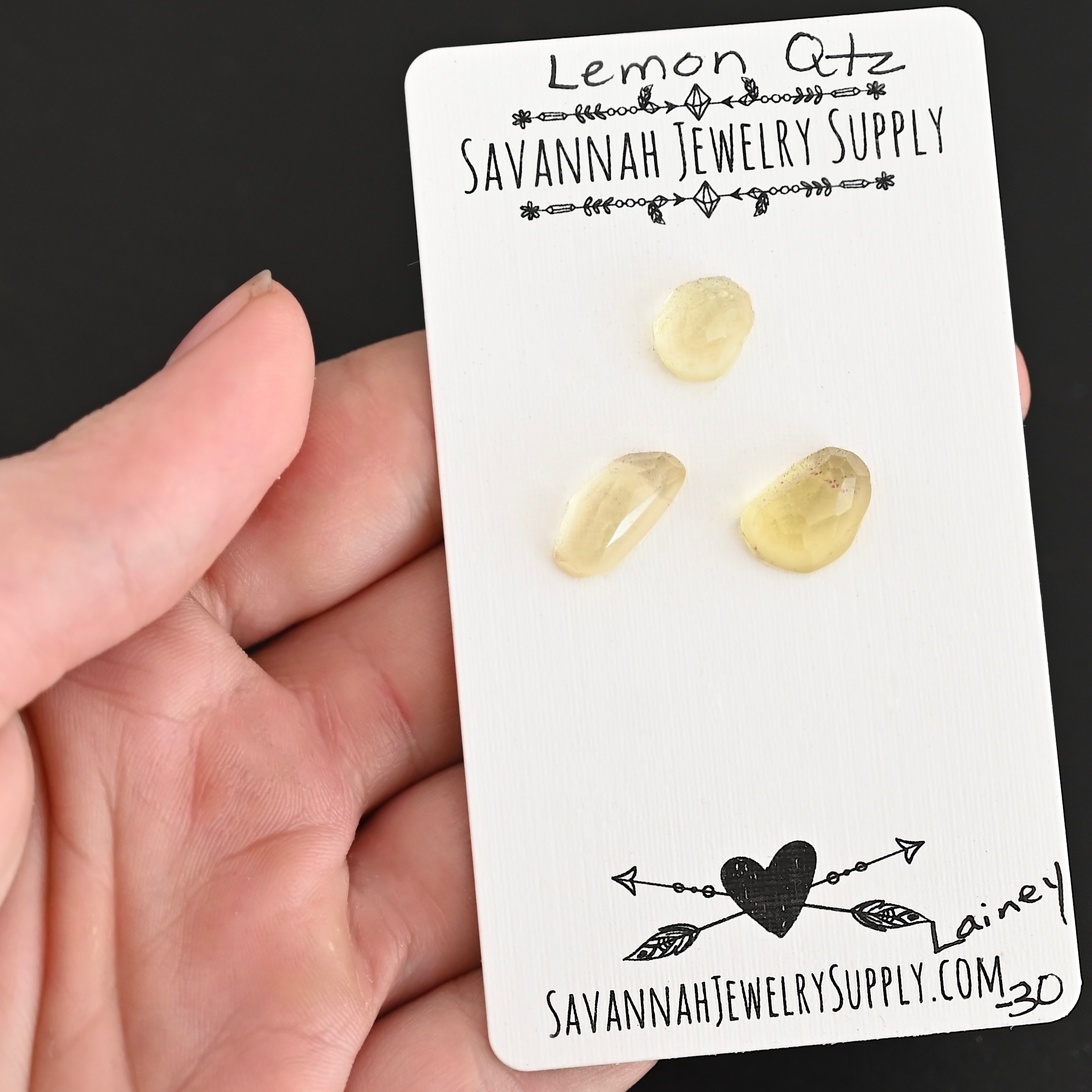 Lainey Rose Cut Lemon Quartz Cabochon Parcel shown in hand