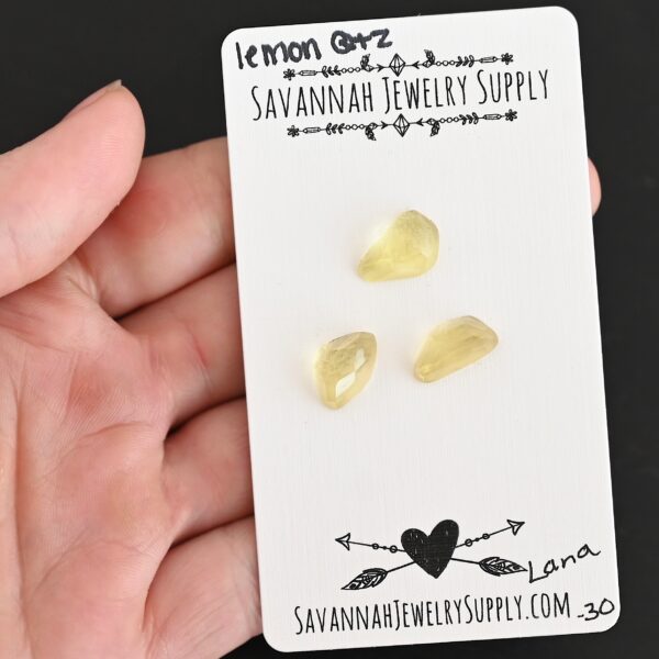 Lana Rose Cut Lemon Quartz Cabochon Parcel shown in hand