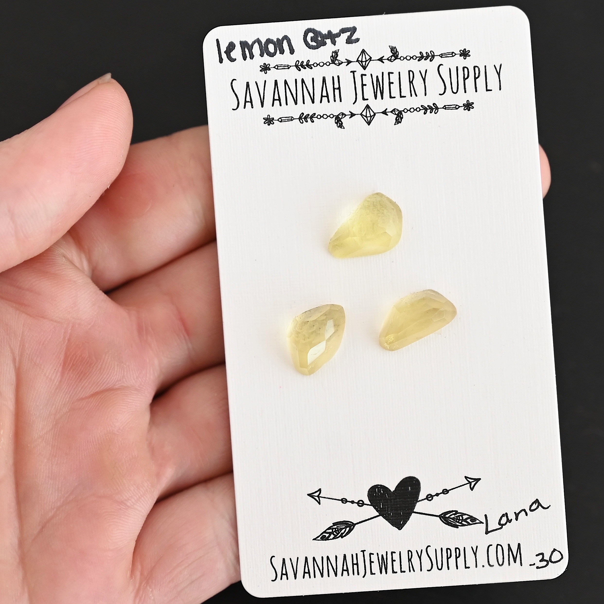 Lana Rose Cut Lemon Quartz Cabochon Parcel shown in hand