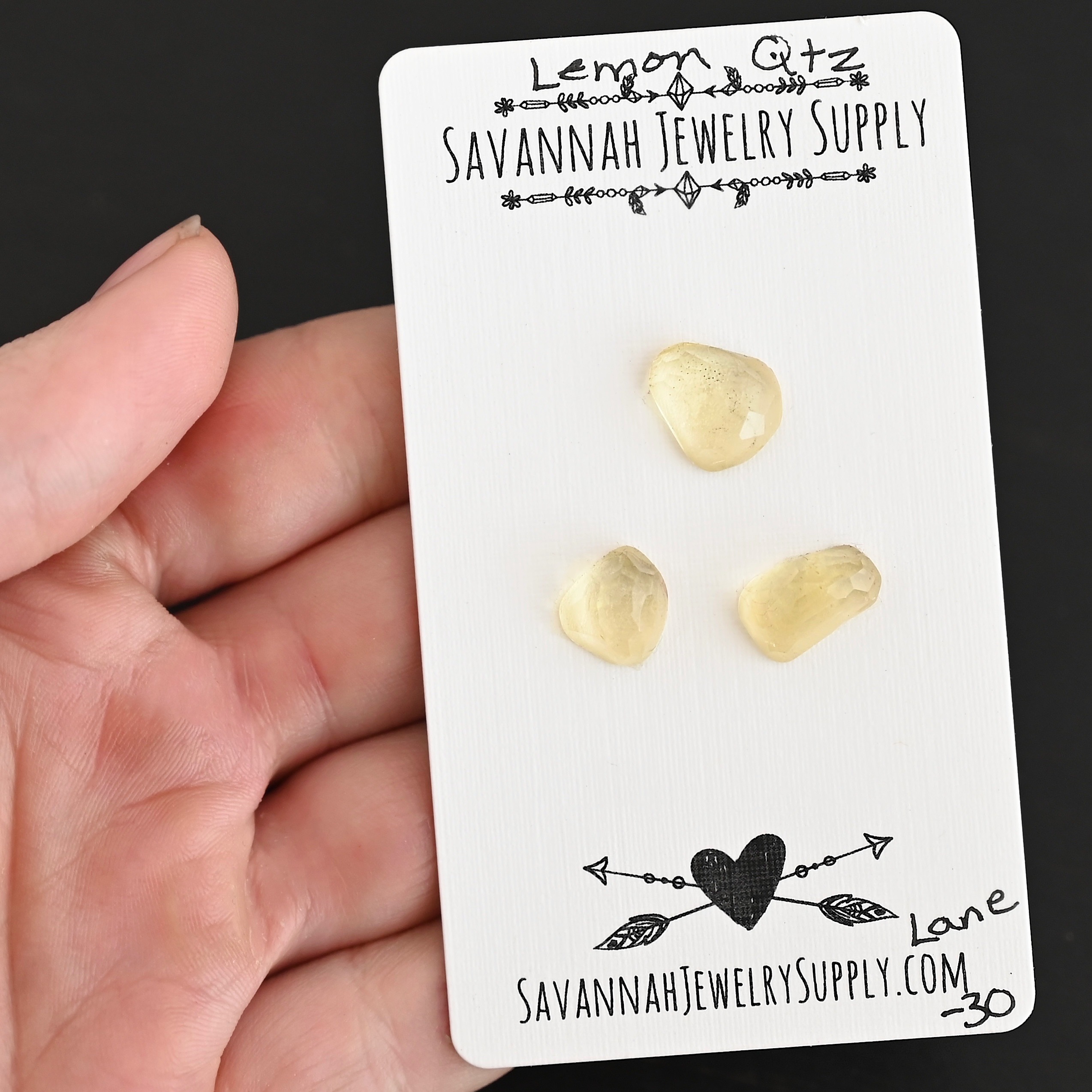 Lane Rose Cut Lemon Quartz Cabochon Parcel shown in hand