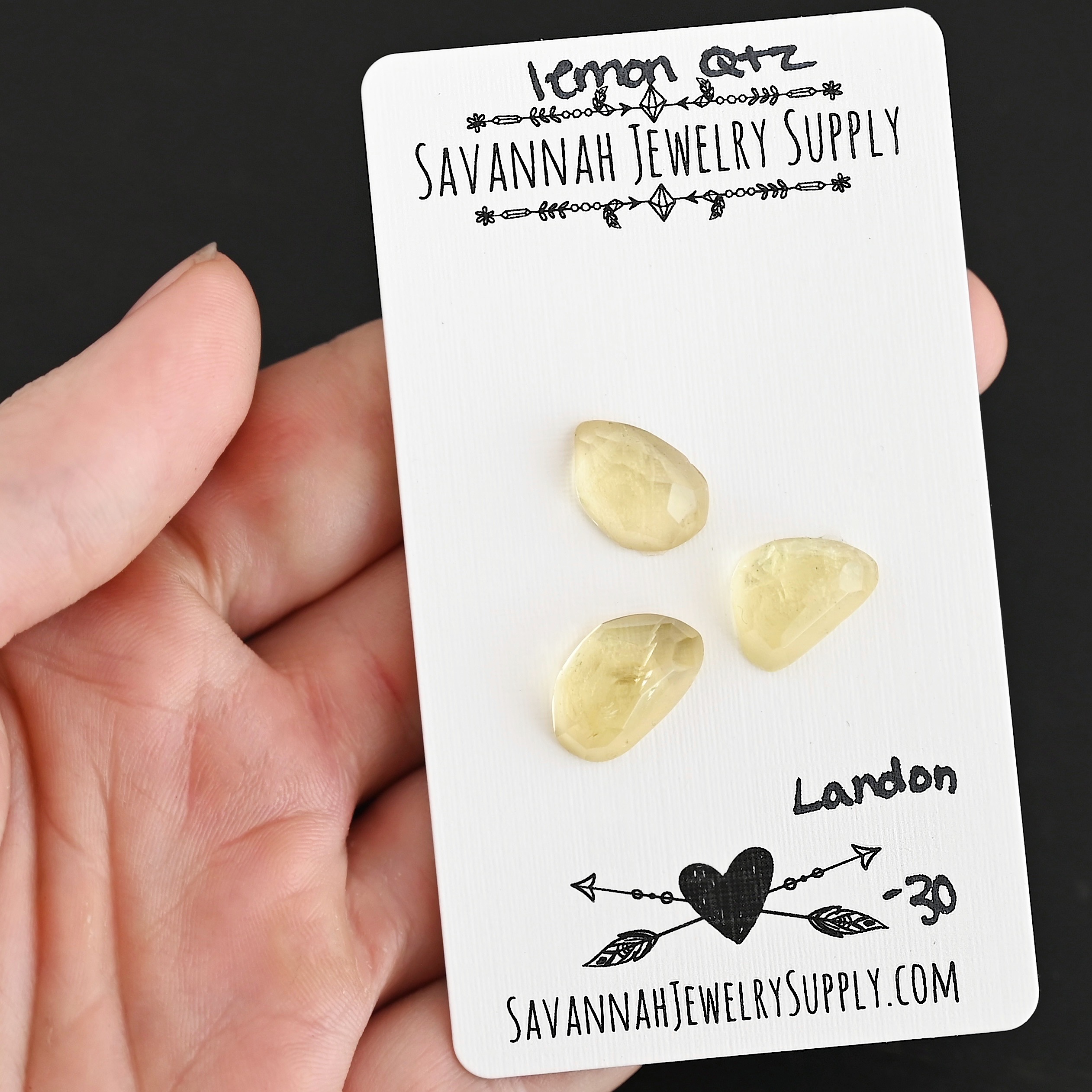 Landon Rose Cut Lemon Quartz Cabochon Parcel shown in hand