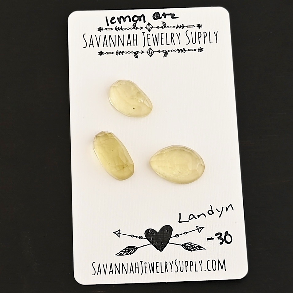 Landyn Rose Cut Lemon Quartz Cabochon Parcel shown on business card