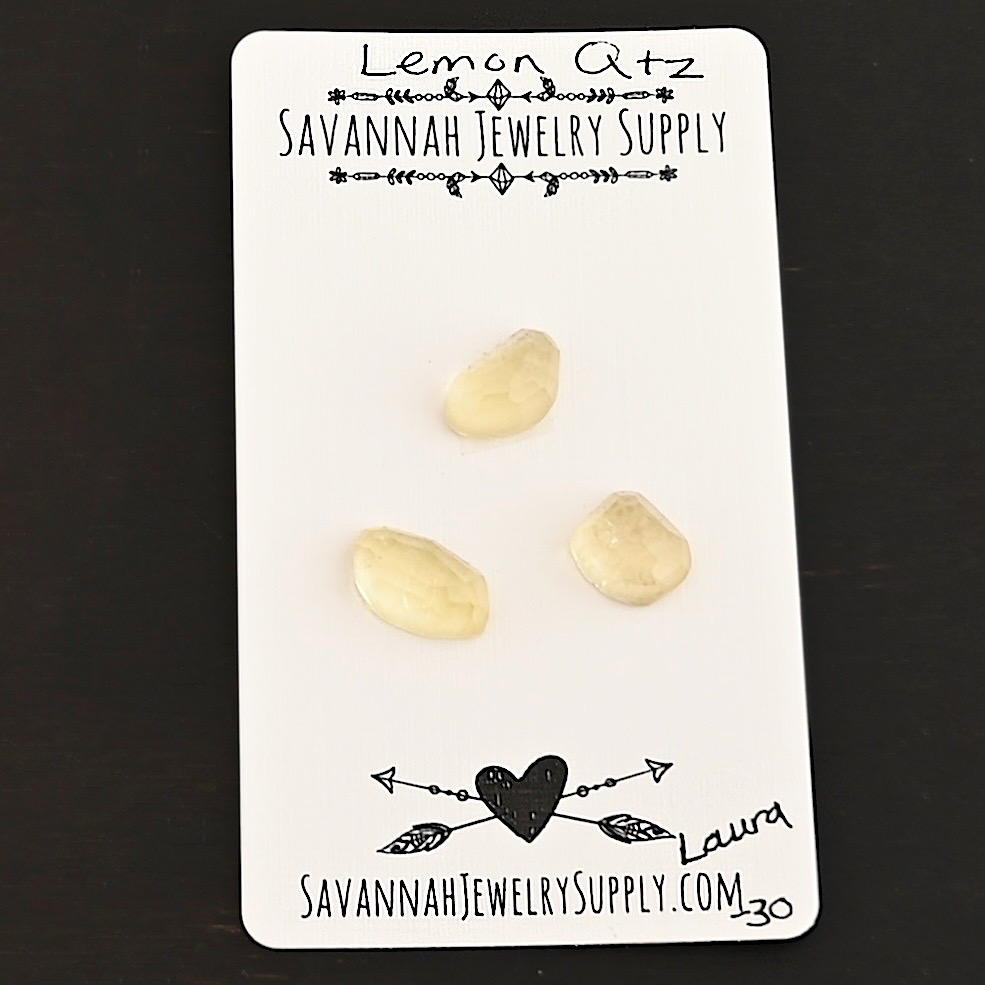 Laura Rose Cut Lemon Quartz Cabochon Parcel shown on business card