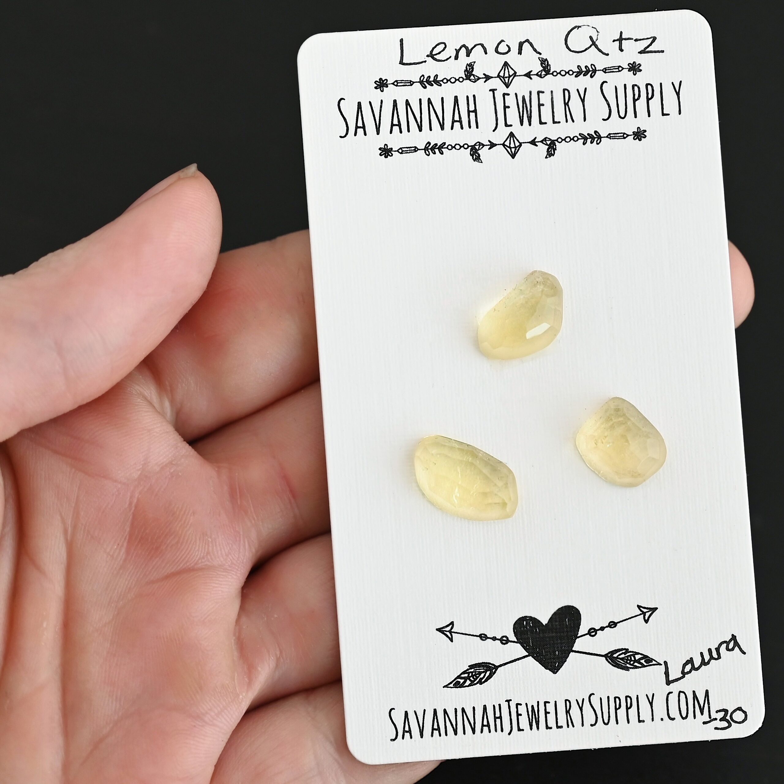 Laura Rose Cut Lemon Quartz Cabochon Parcel shown in hand