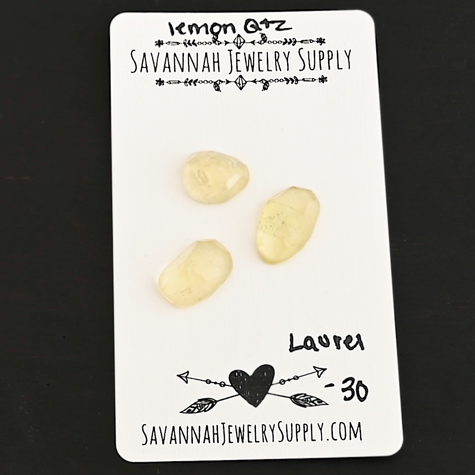 Laurel Rose Cut Lemon Quartz Cabochon Parcel shown on business card