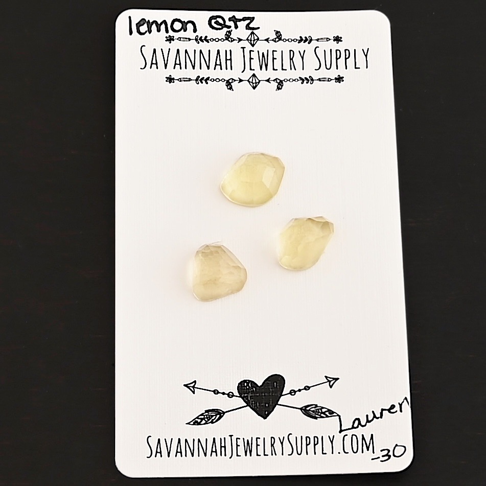 Lauren Rose Cut Lemon Quartz Cabochon Parcel shown on business card