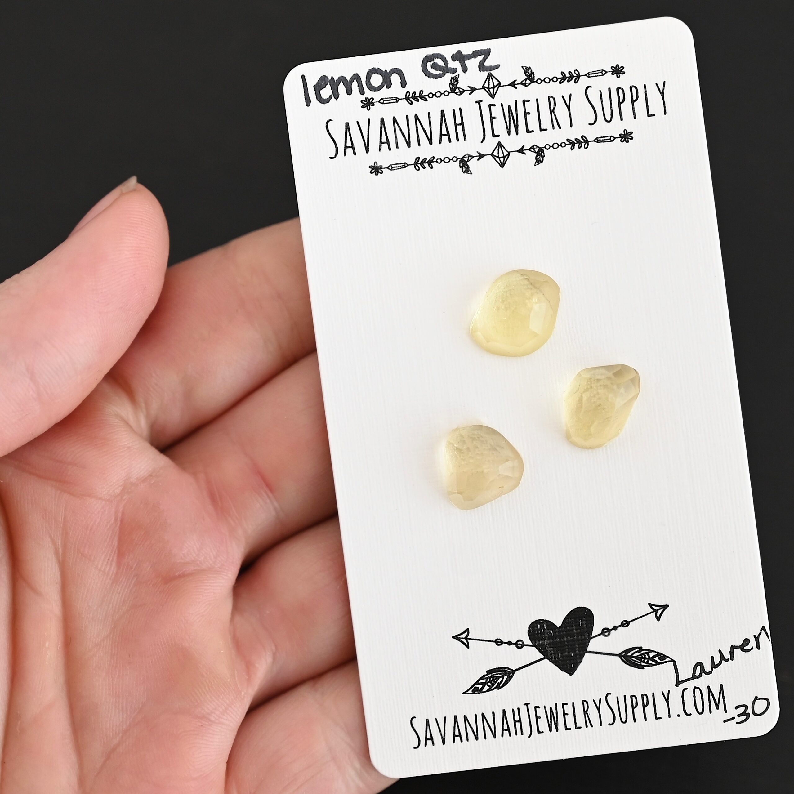 Lauren Rose Cut Lemon Quartz Cabochon Parcel shown in hand