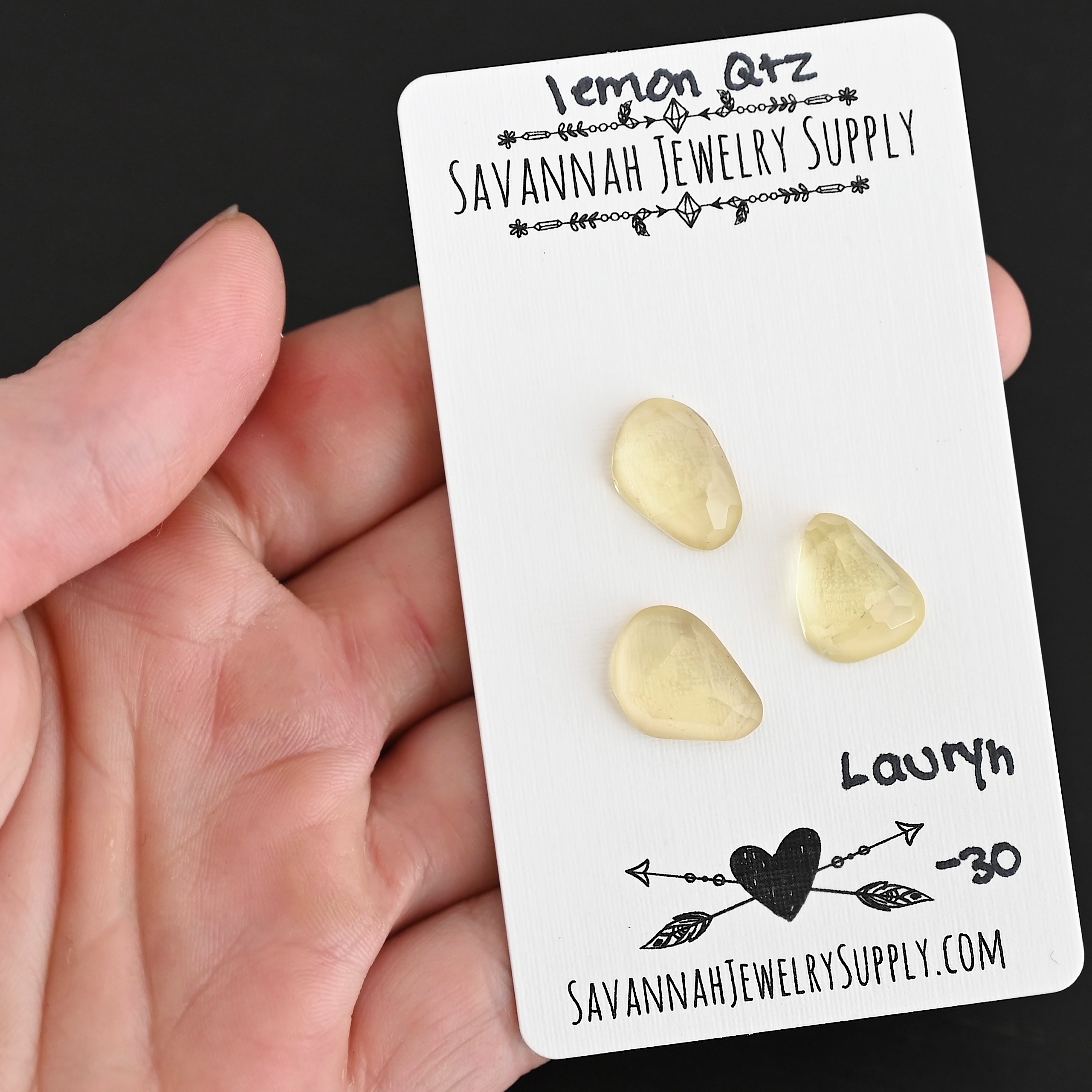 Lauryn Rose Cut Lemon Quartz Cabochon Parcel shown in hand