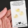 Lawson Rose Cut Lemon Quartz Cabochon Parcel shown in hand