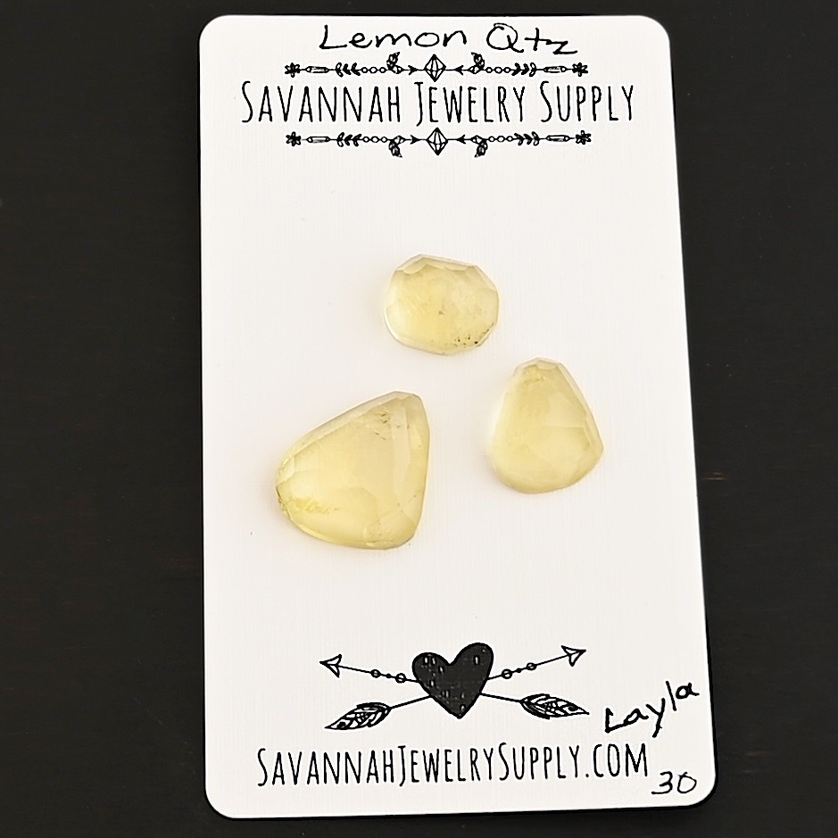 Layla Rose Cut Lemon Quartz Cabochon Parcel shown on business card