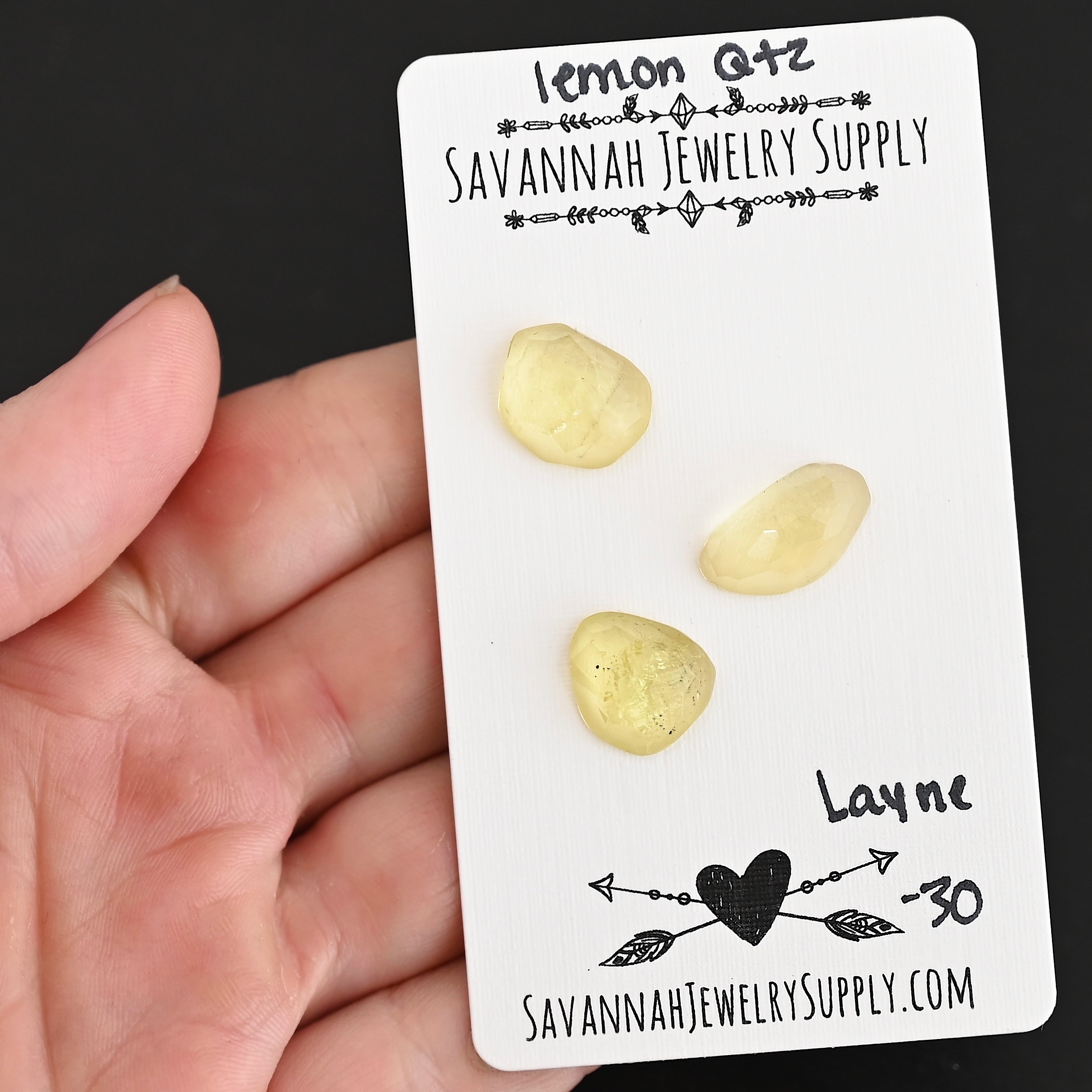 Layne Rose Cut Lemon Quartz Cabochon Parcel shown in hand