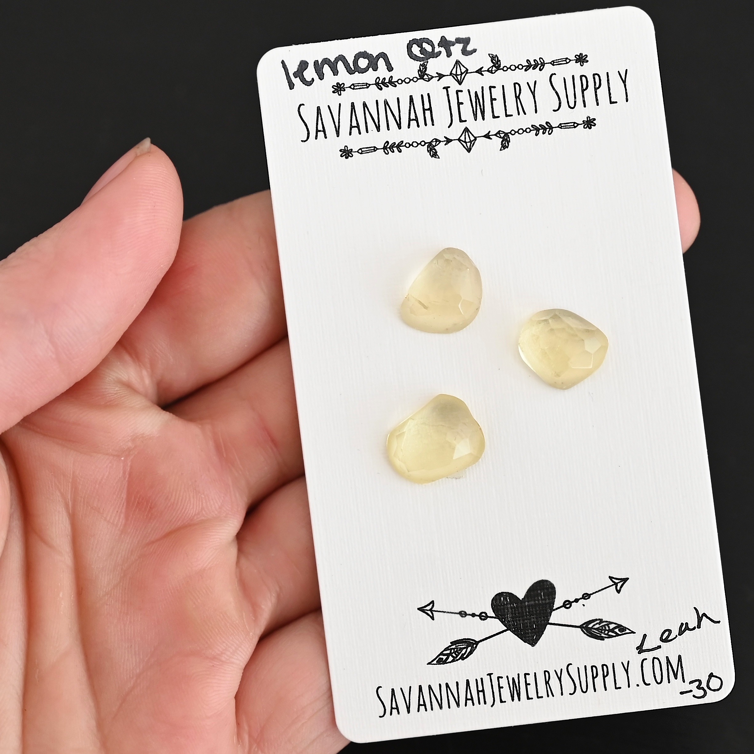 Leah Rose Cut Lemon Quartz Cabochon Parcel shown in hand