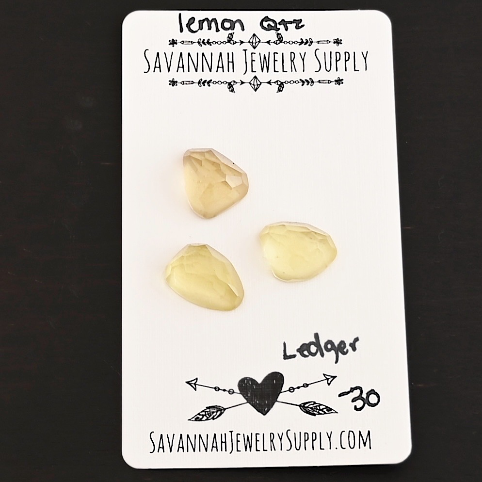 Ledger Rose Cut Lemon Quartz Cabochon Parcel shown on business card