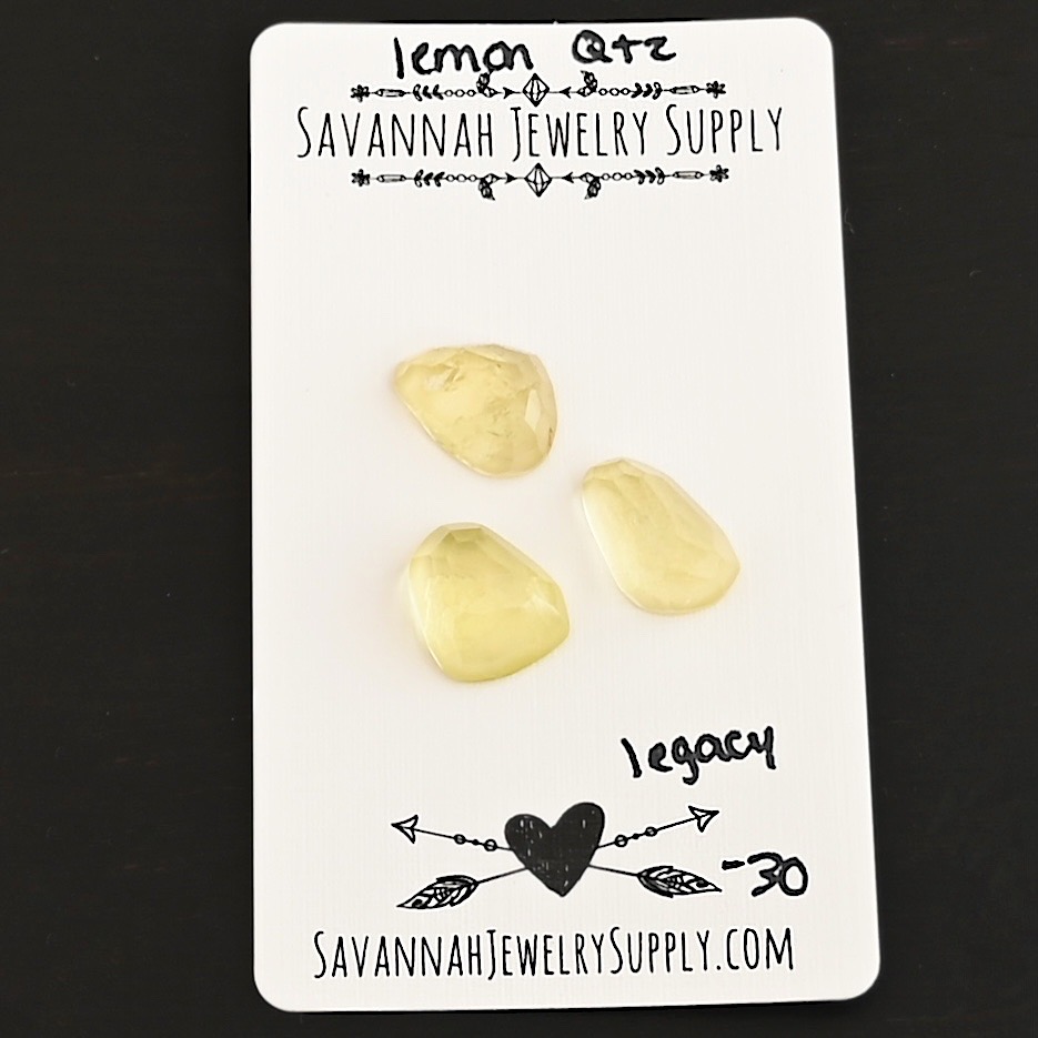 Legacy Rose Cut Lemon Quartz Cabochon Parcel shown on business card