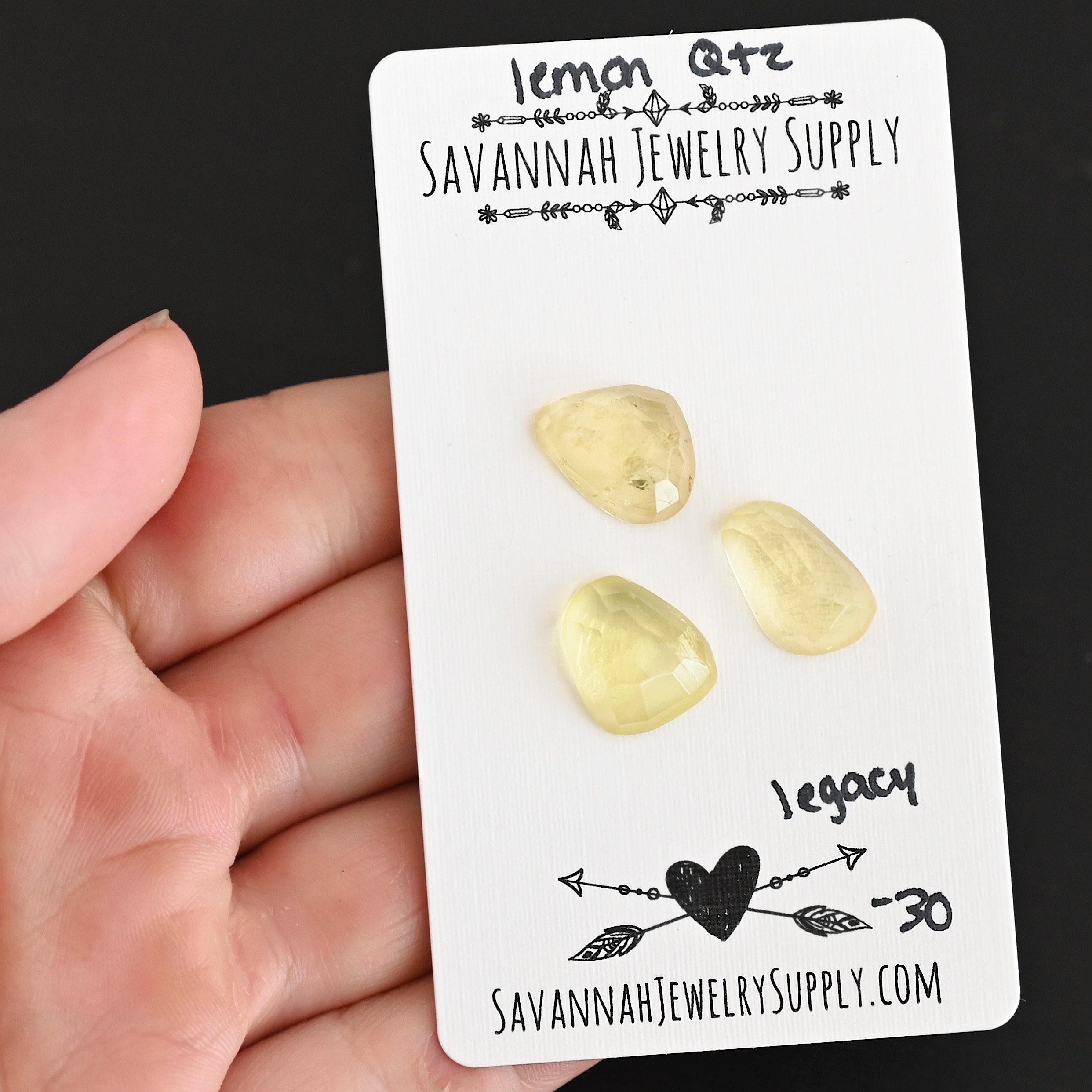 Legacy Rose Cut Lemon Quartz Cabochon Parcel shown in hand