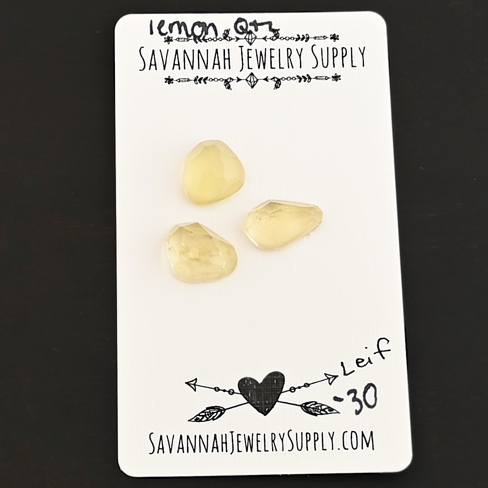 Leif Rose Cut Lemon Quartz Cabochon Parcel shown on business card