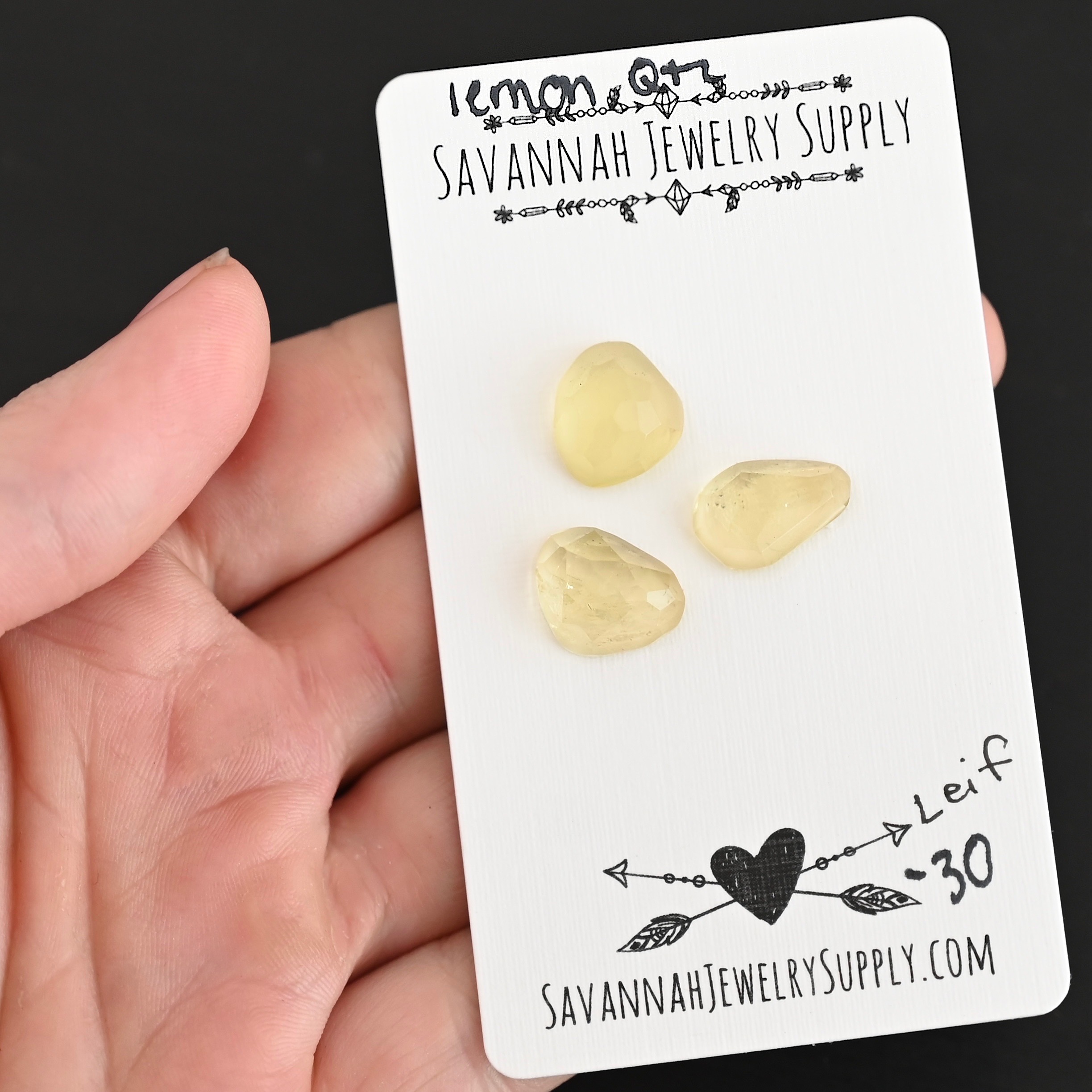 Leif Rose Cut Lemon Quartz Cabochon Parcel shown in hand