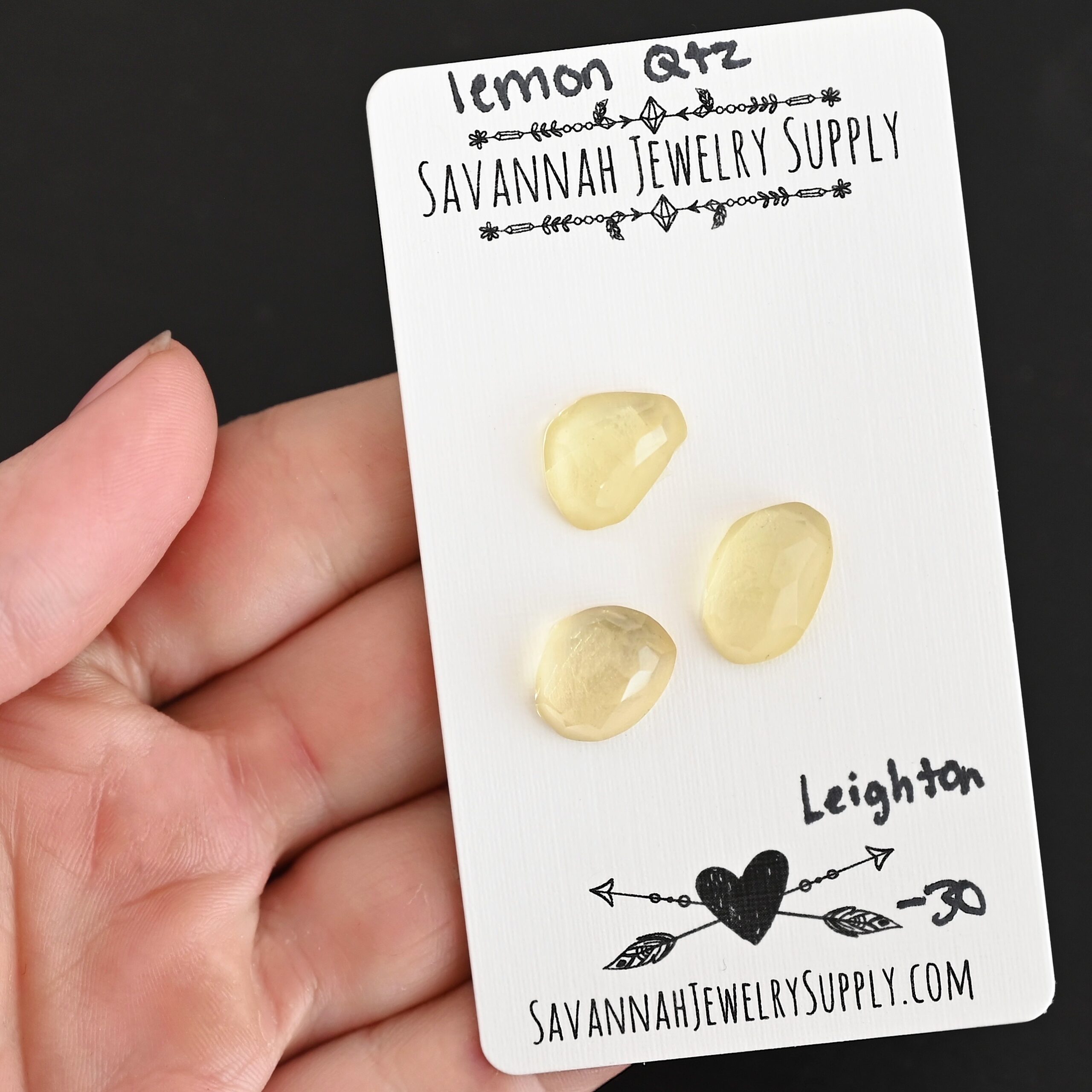 Leighton Rose Cut Lemon Quartz Cabochon Parcel shown in hand