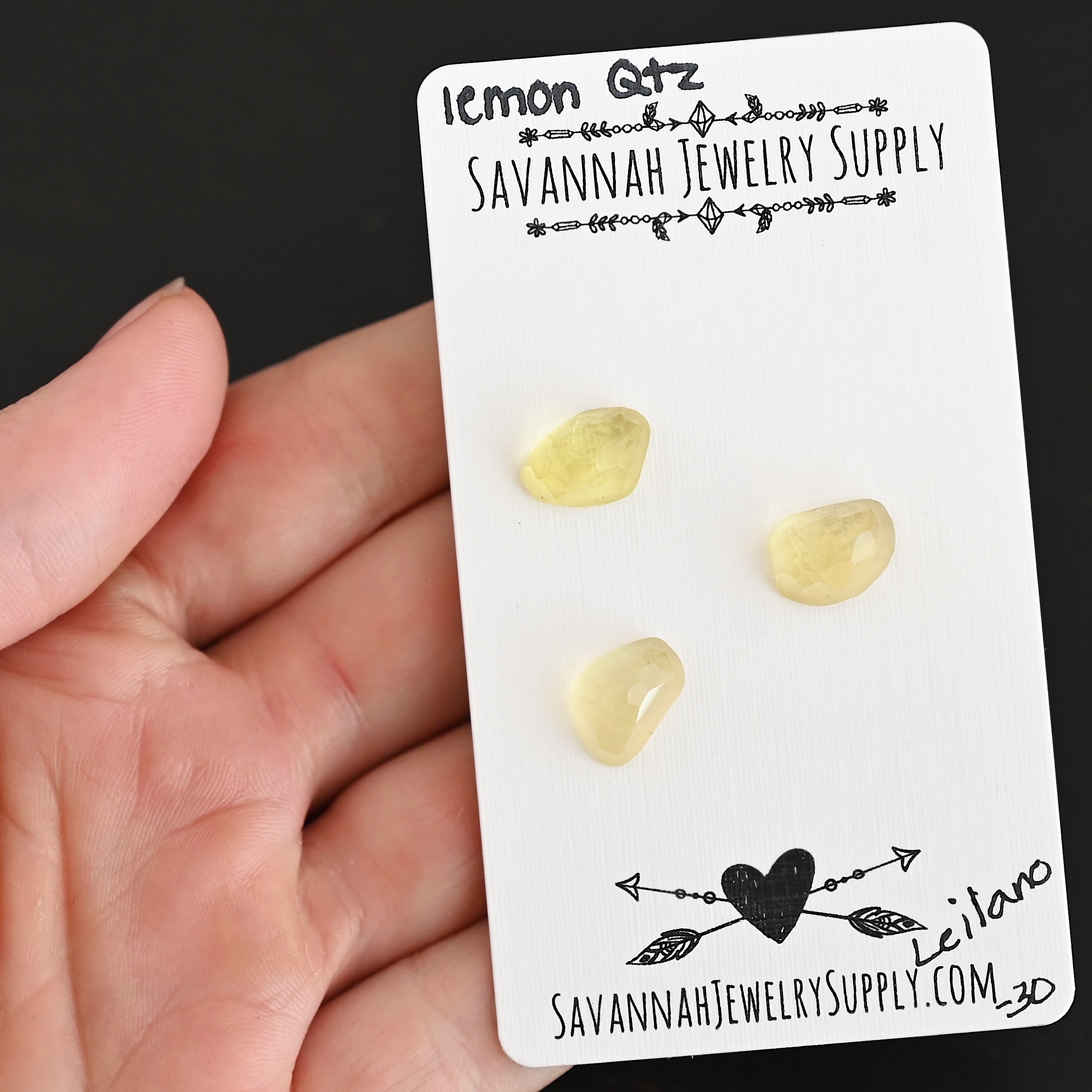 Leilano Rose Cut Lemon Quartz Cabochon Parcel shown in hand