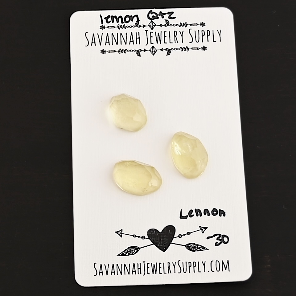 Lennon Rose Cut Lemon Quartz Cabochon Parcel shown on business card