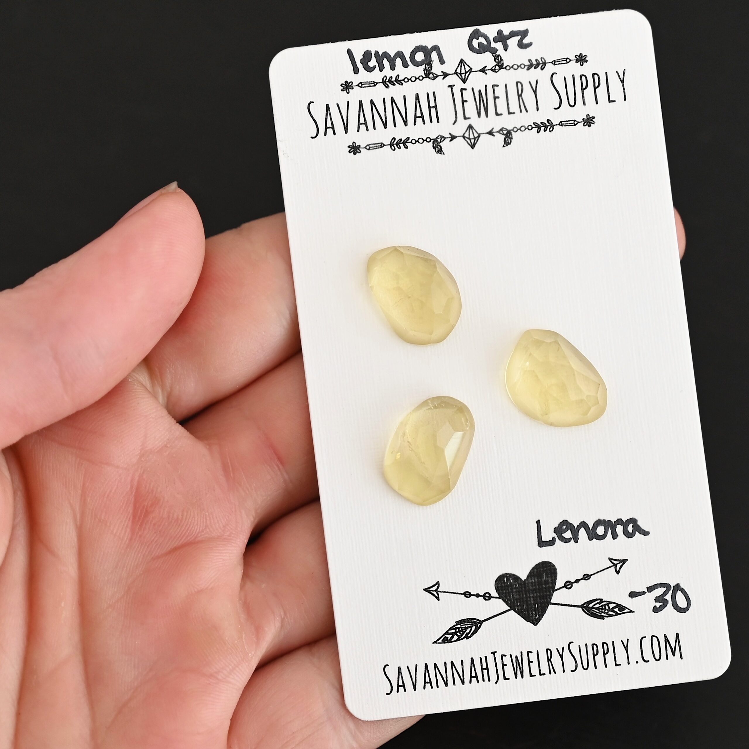 Lenora Rose Cut Lemon Quartz Cabochon Parcel shown in hand