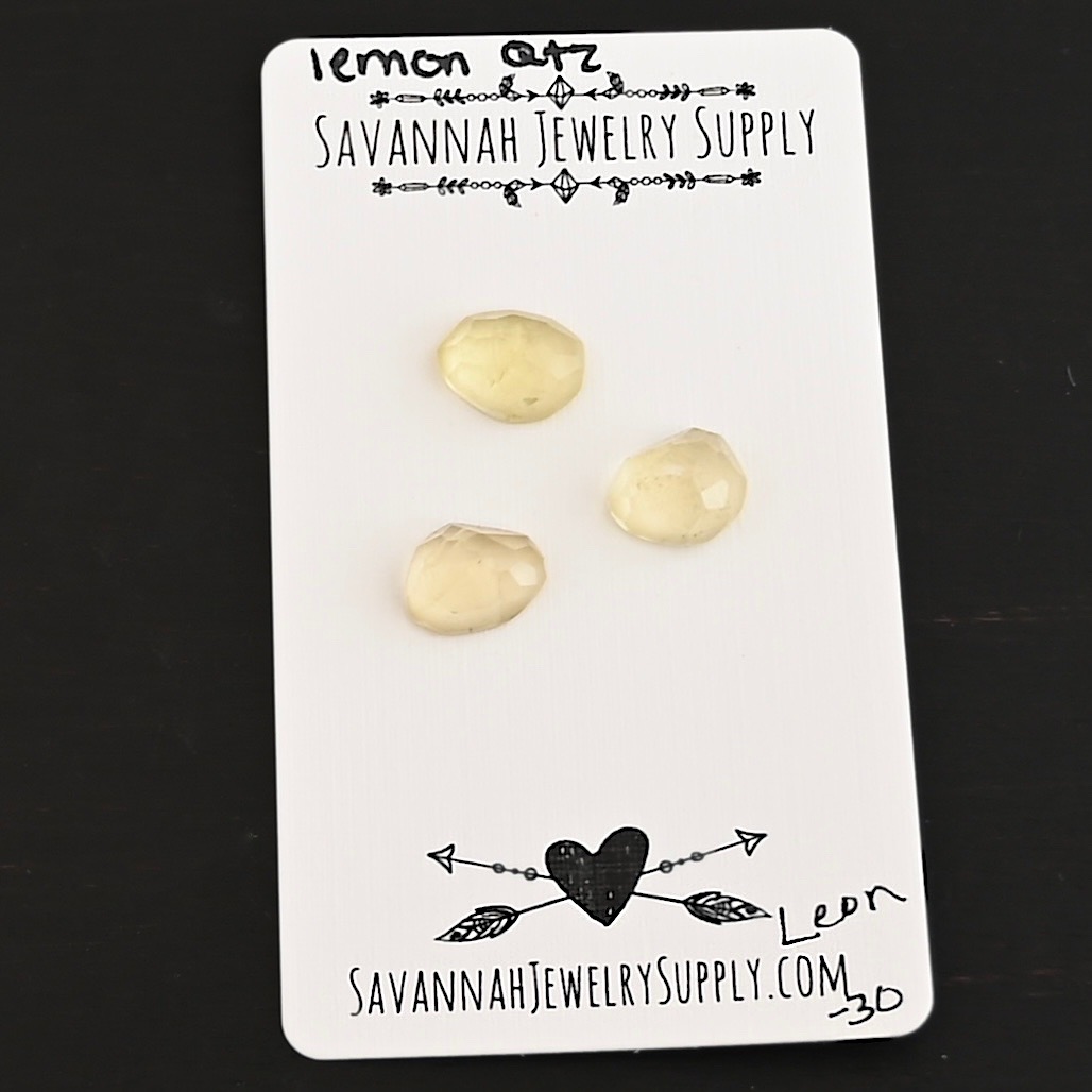Leon Rose Cut Lemon Quartz Cabochon Parcel shown on business card