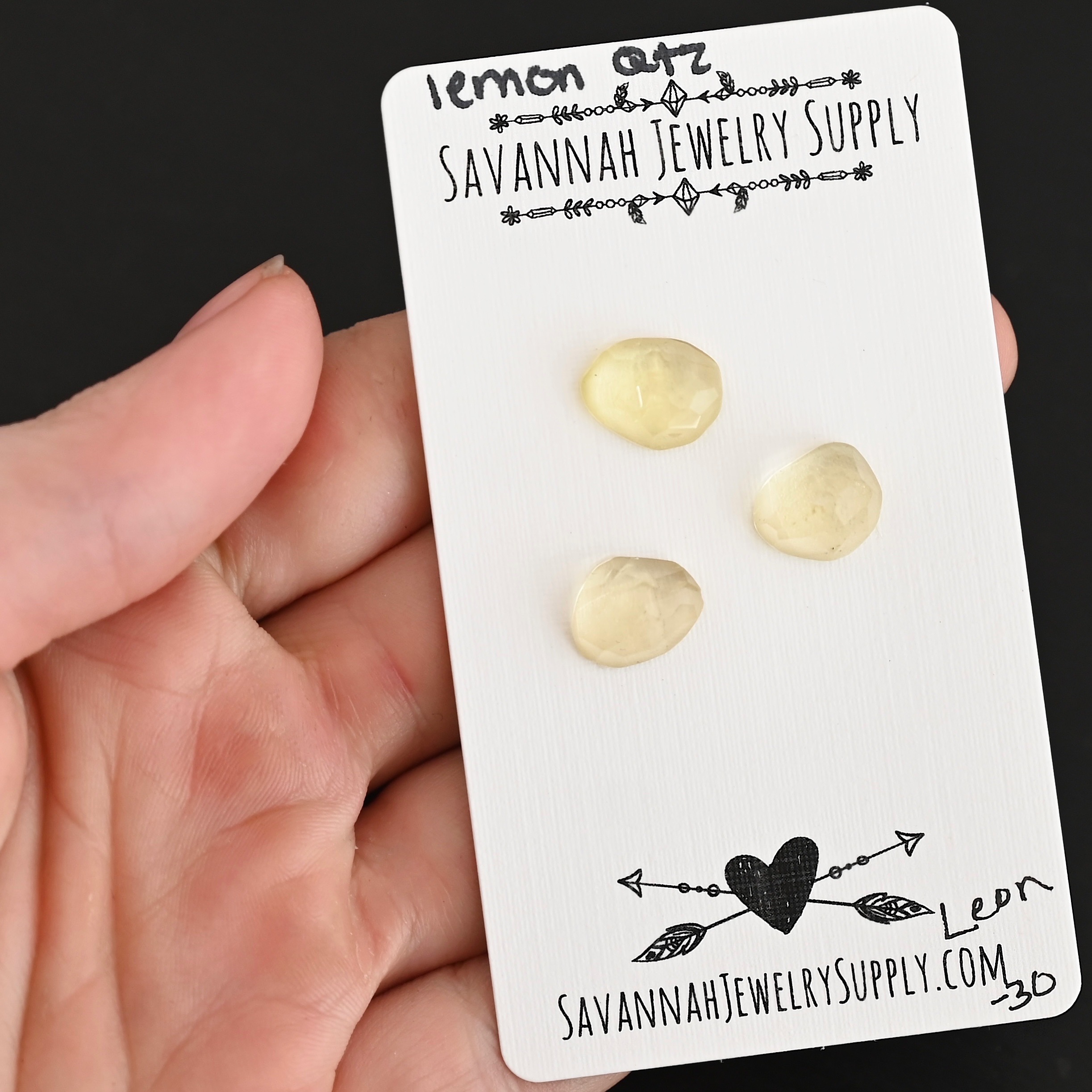 Leon Rose Cut Lemon Quartz Cabochon Parcel shown in hand