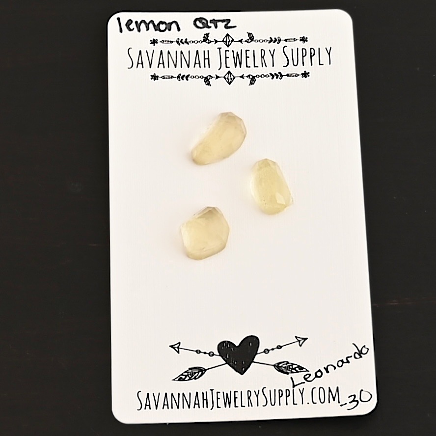 Leonardo Rose Cut Lemon Quartz Cabochon Parcel shown on business card