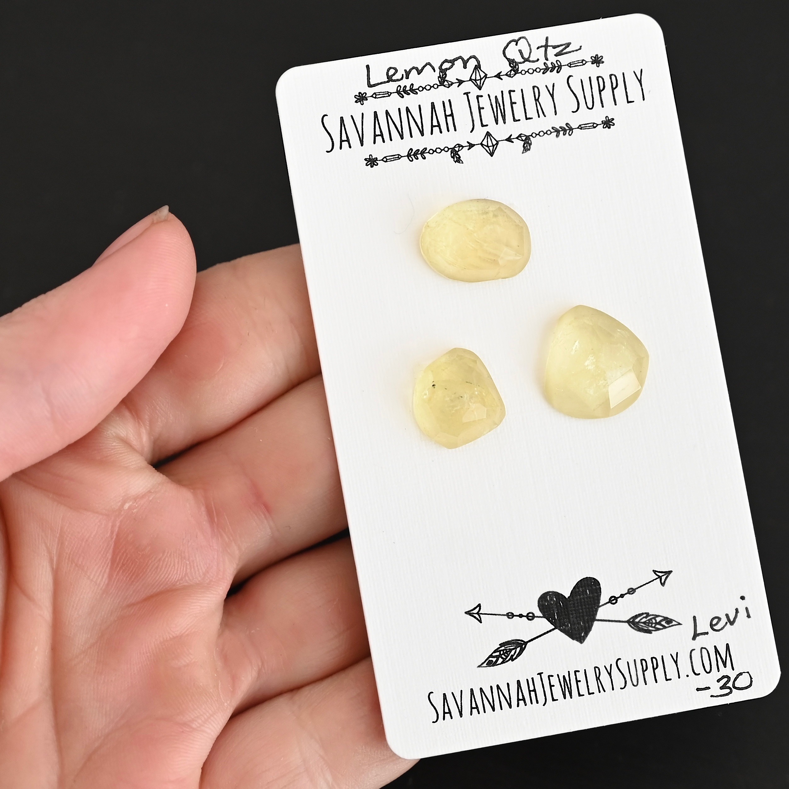 Levi Rose Cut Lemon Quartz Cabochon Parcel shown in hand