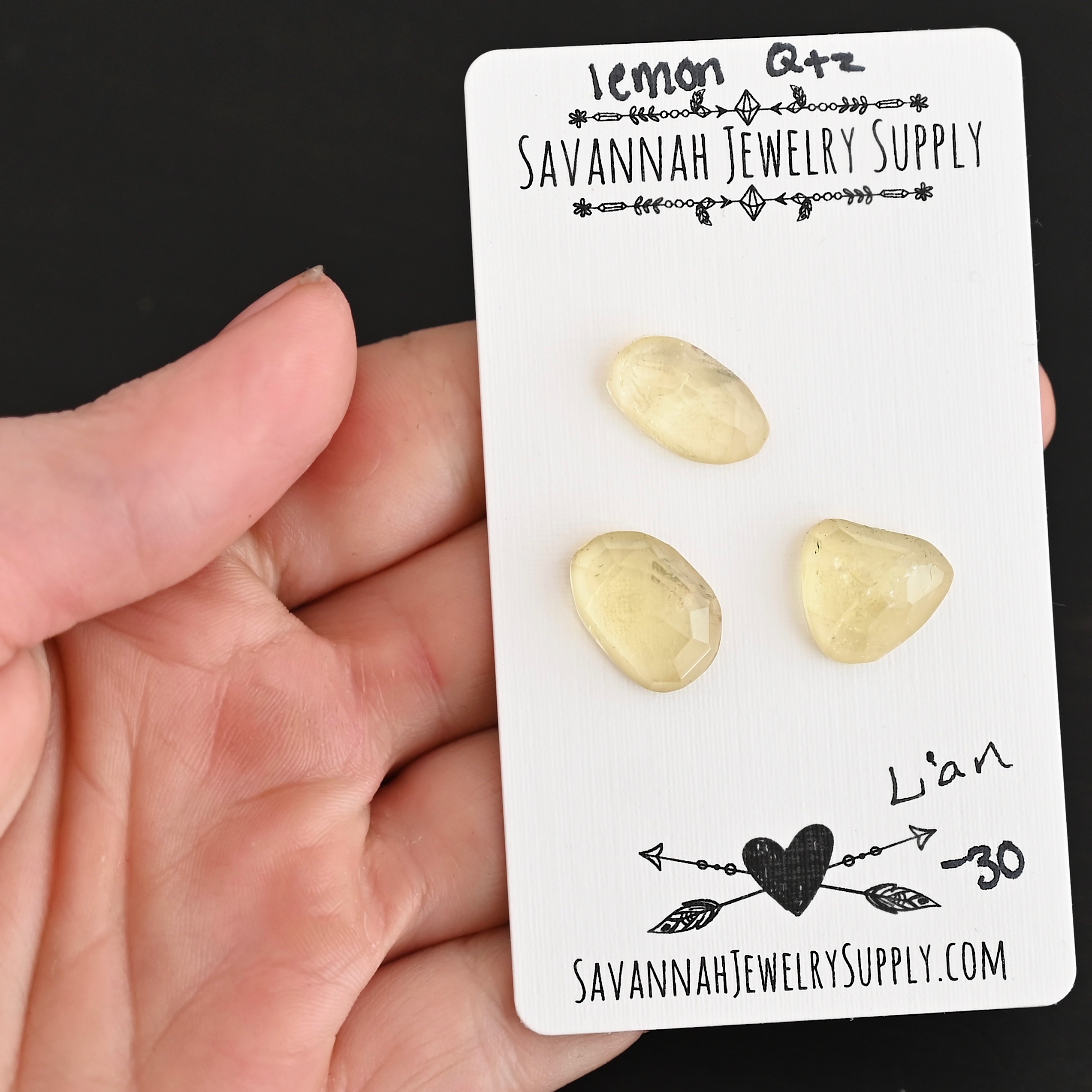 Lian Rose Cut Lemon Quartz Cabochon Parcel shown in hand