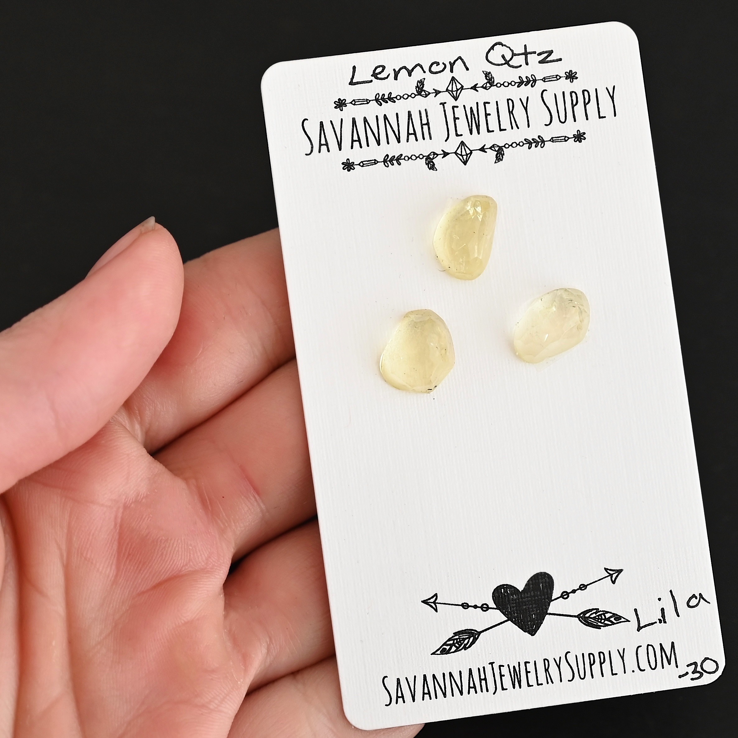 Lila Rose Cut Lemon Quartz Cabochon Parcel shown in hand