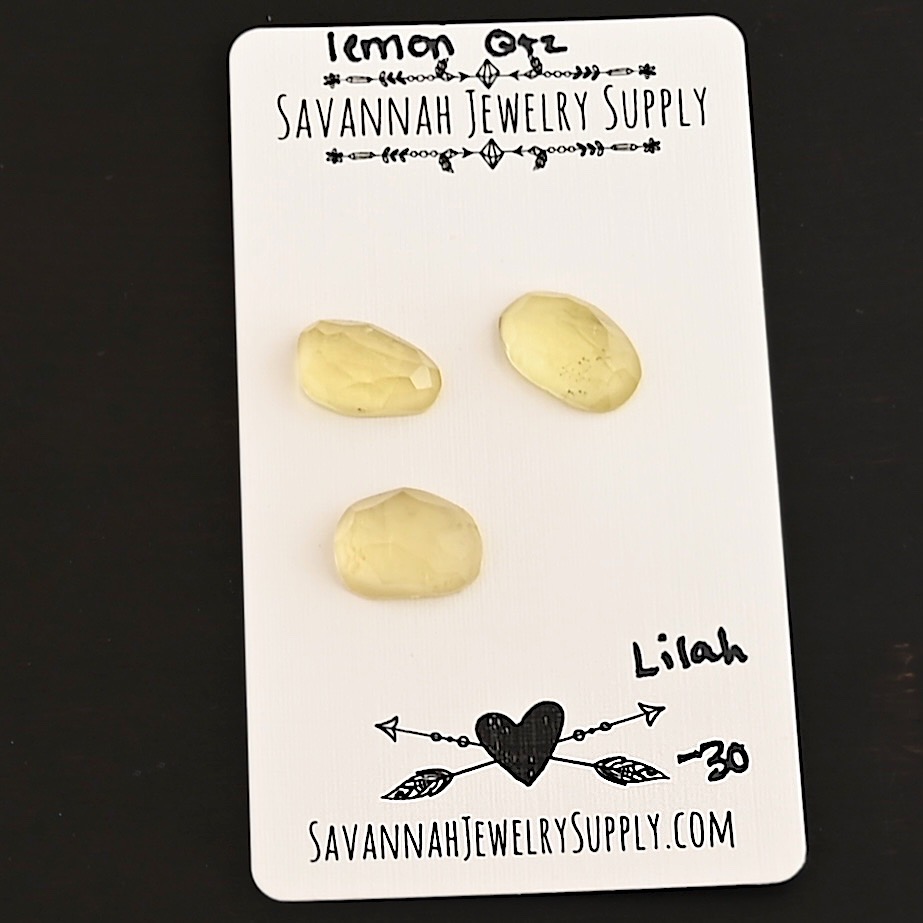 Lilah Rose Cut Lemon Quartz Cabochon Parcel shown on business card