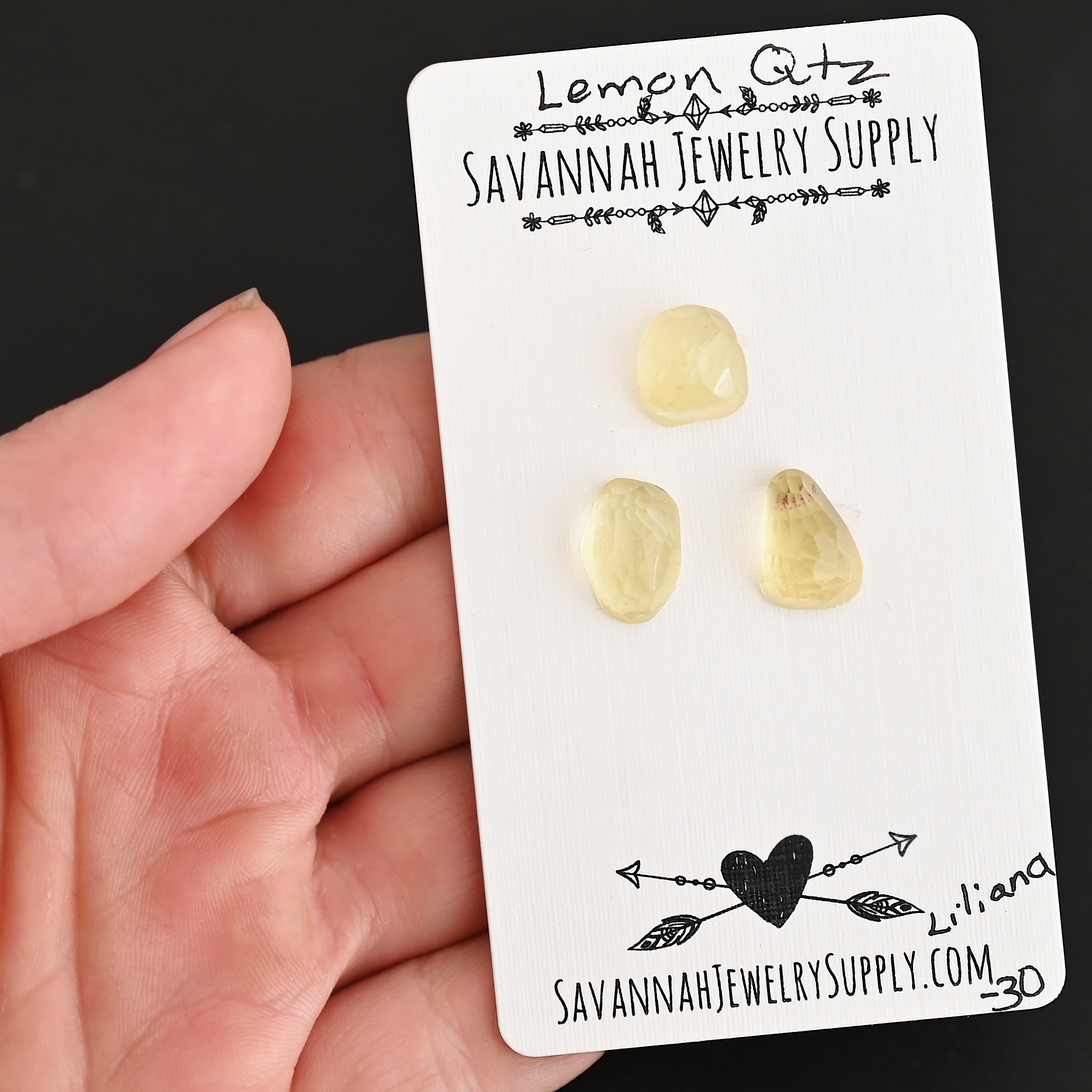 Liliana Rose Cut Lemon Quartz Cabochon Parcel shown in hand