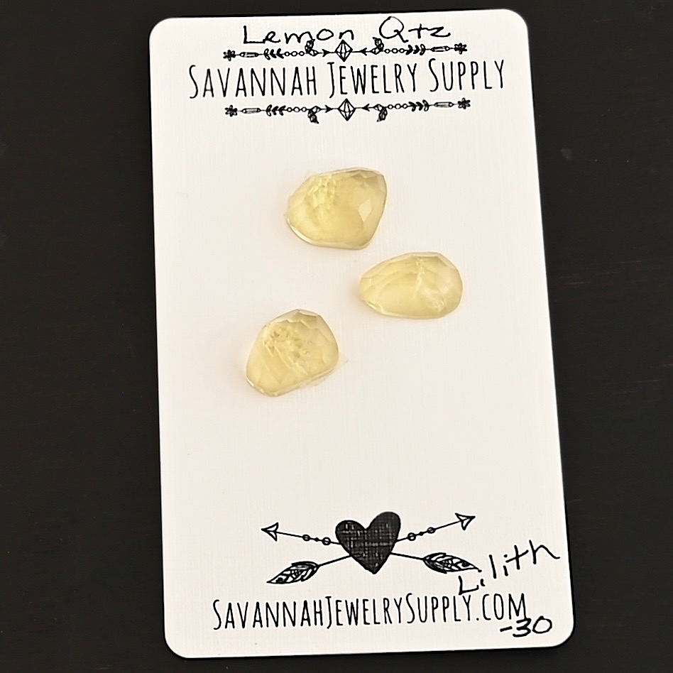 Lilith Rose Cut Lemon Quartz Cabochon Parcel shown on business card