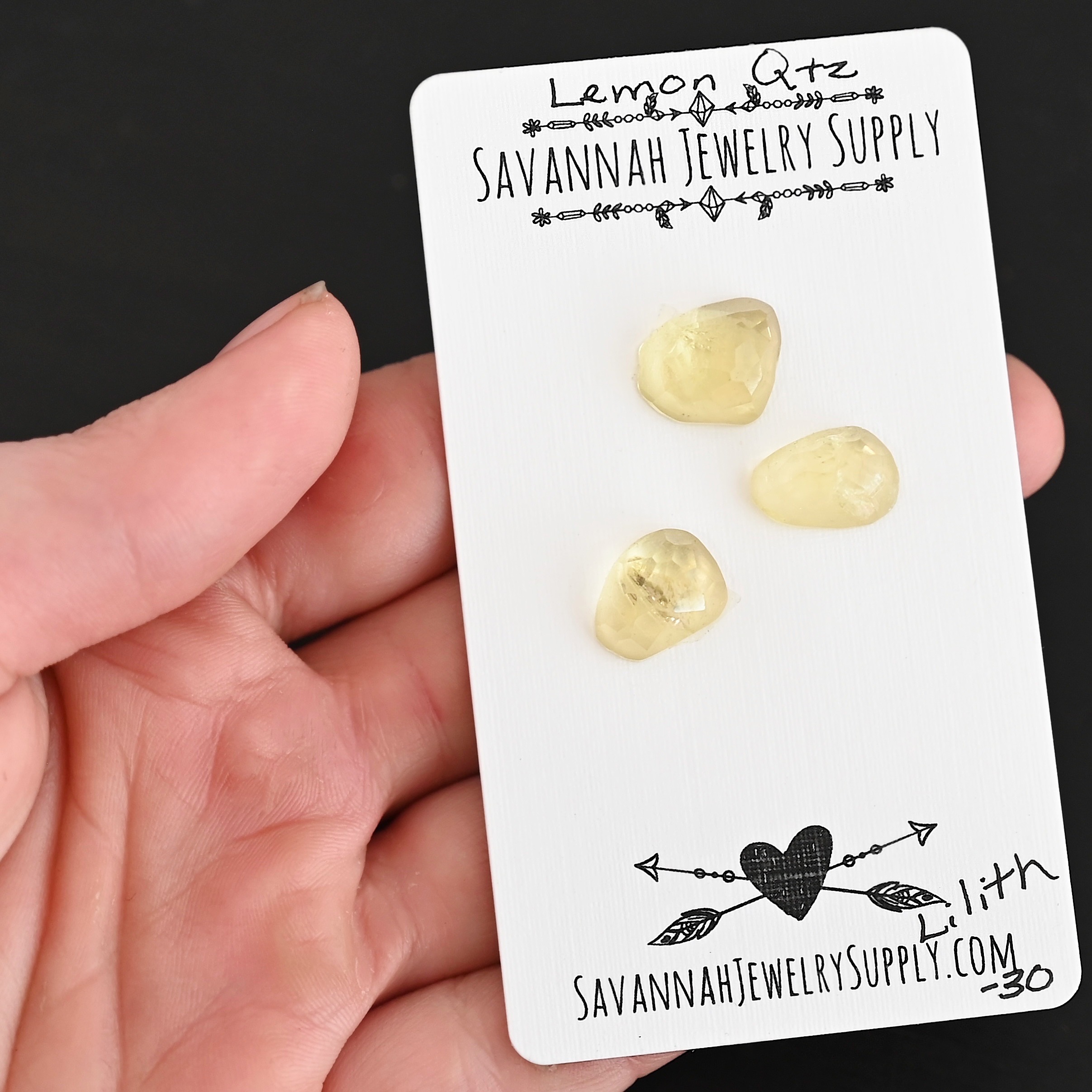 Lilith Rose Cut Lemon Quartz Cabochon Parcel shown in hand