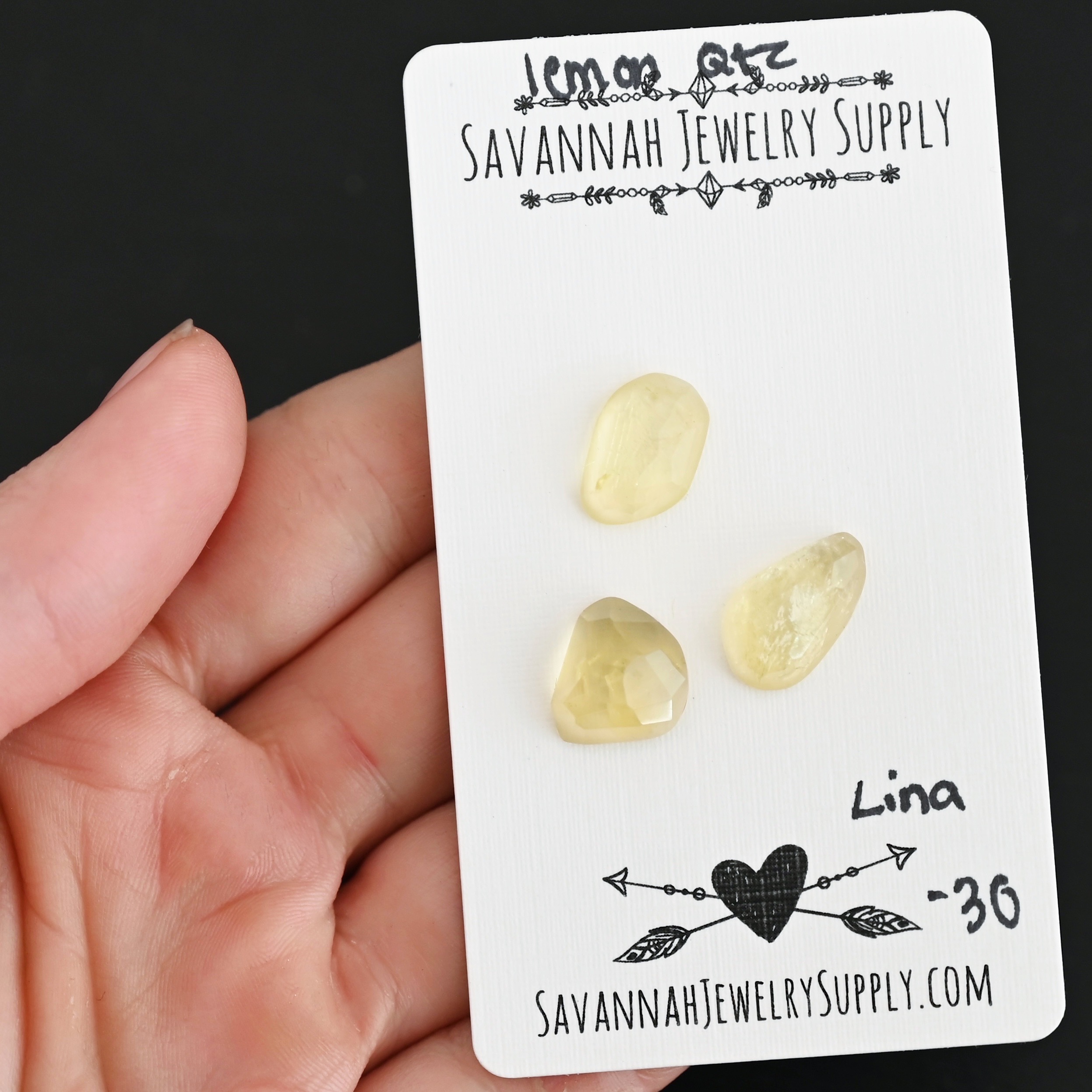 Lina Rose Cut Lemon Quartz Cabochon Parcel shown in hand