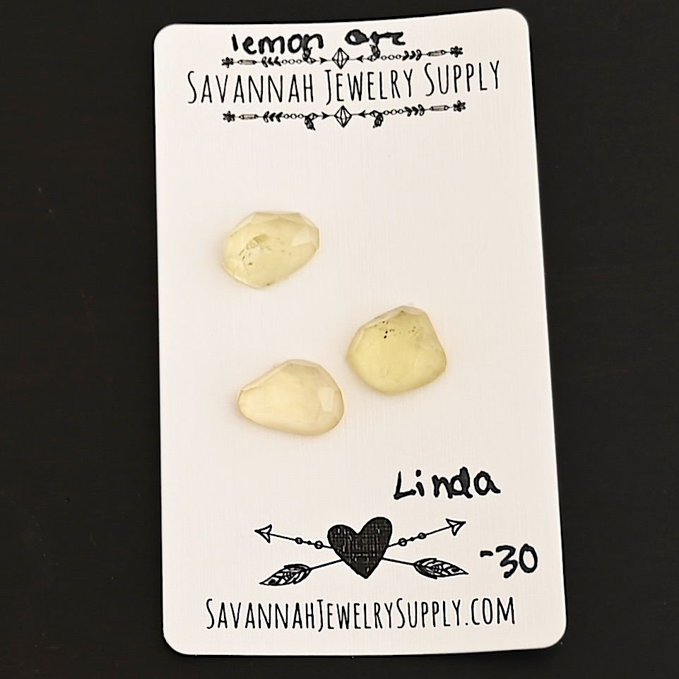 Linda Rose Cut Lemon Quartz Cabochon Parcel shown on business card