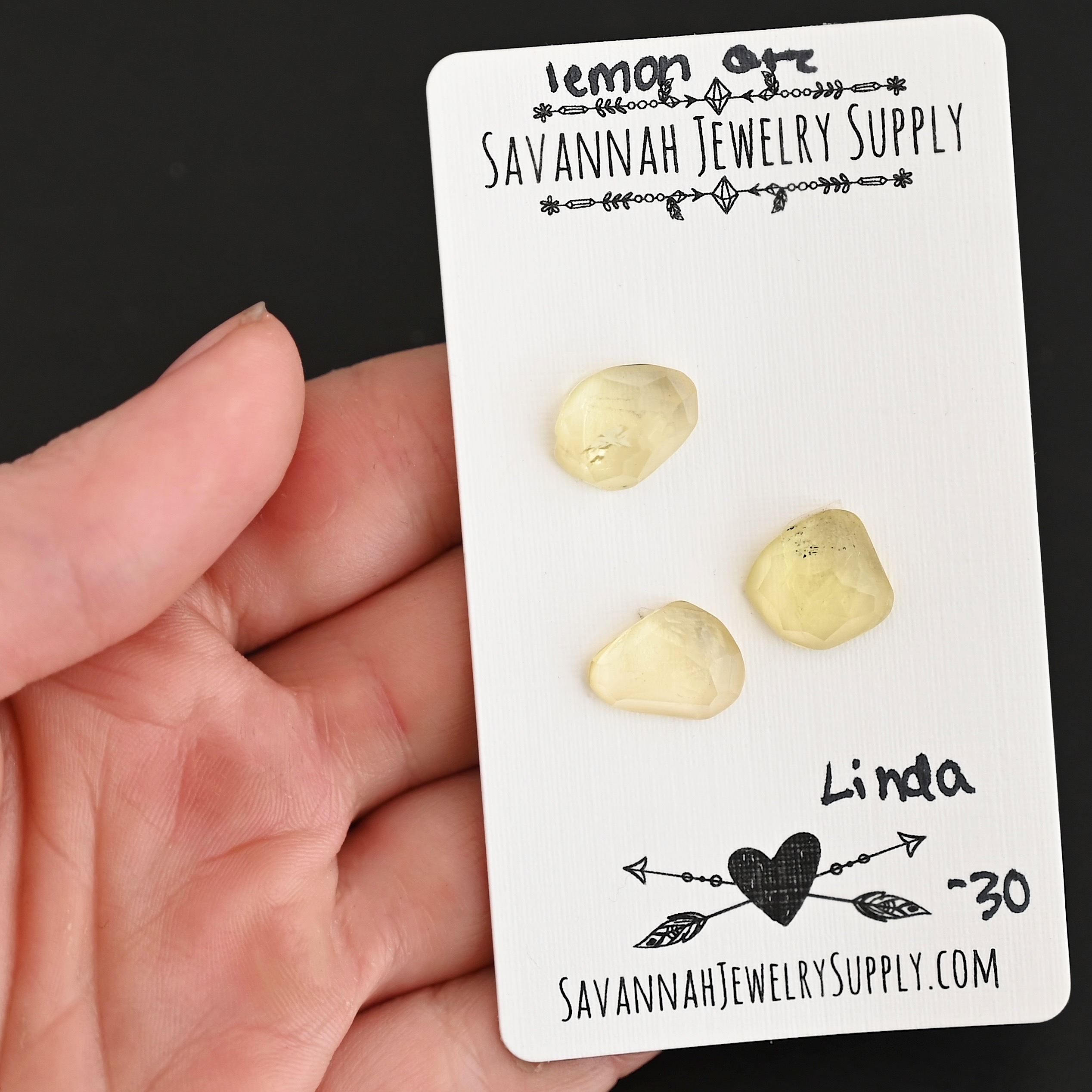 Linda Rose Cut Lemon Quartz Cabochon Parcel shown in hand