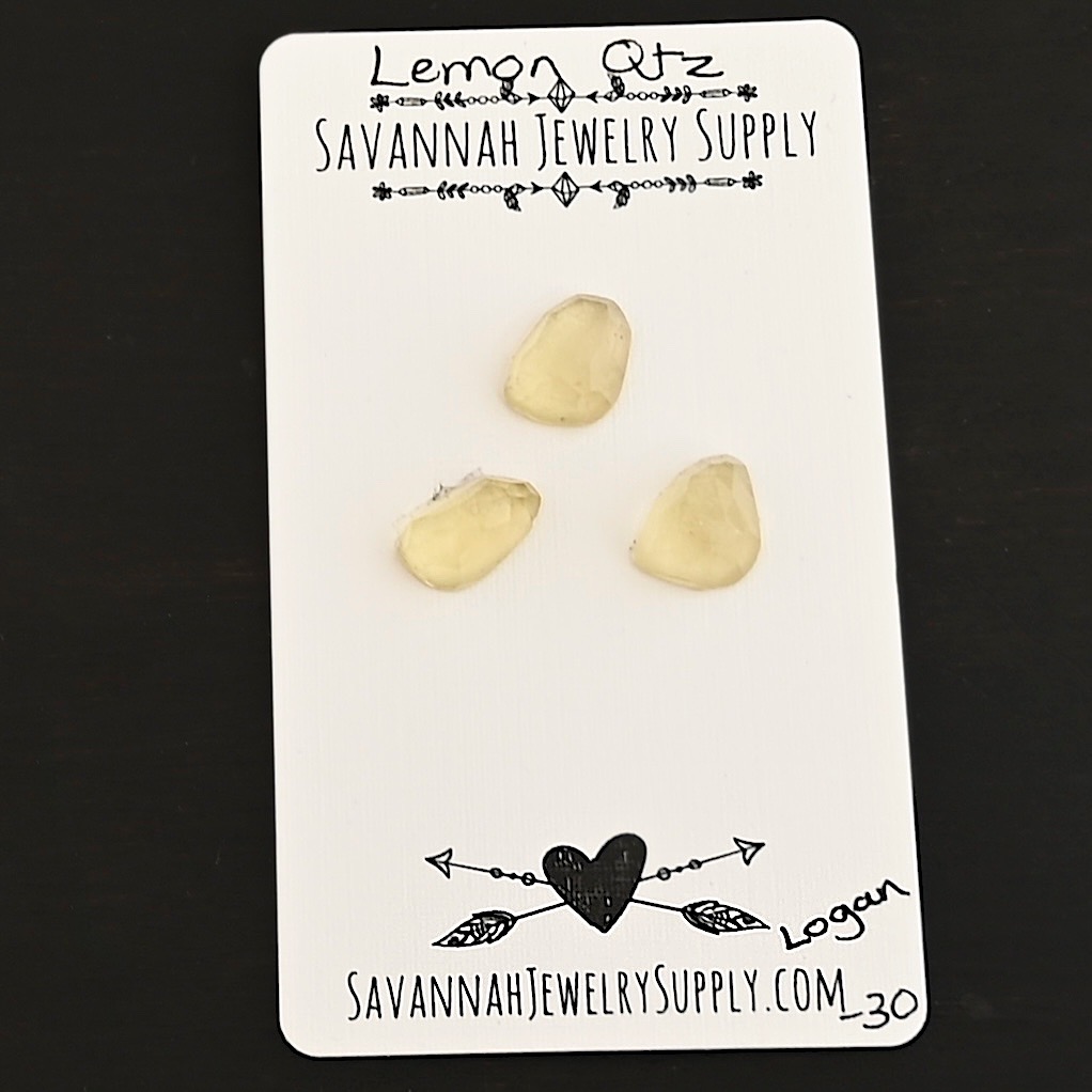 Logan Rose Cut Lemon Quartz Cabochon Parcel shown on business card